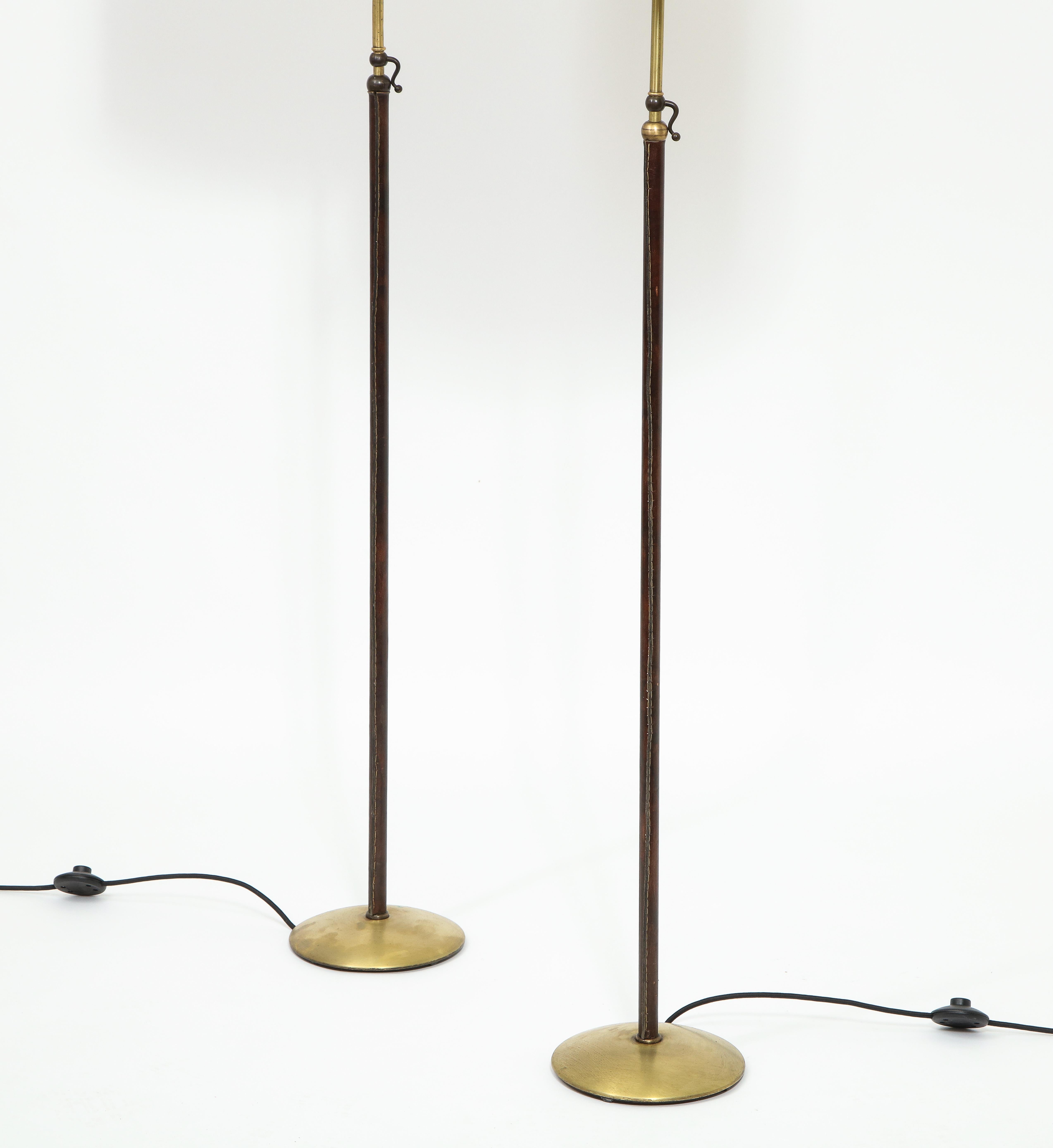 French Pair of Leather and Brass Adjustable Floor Lamps by Jacques Adnet, France, 1950s For Sale