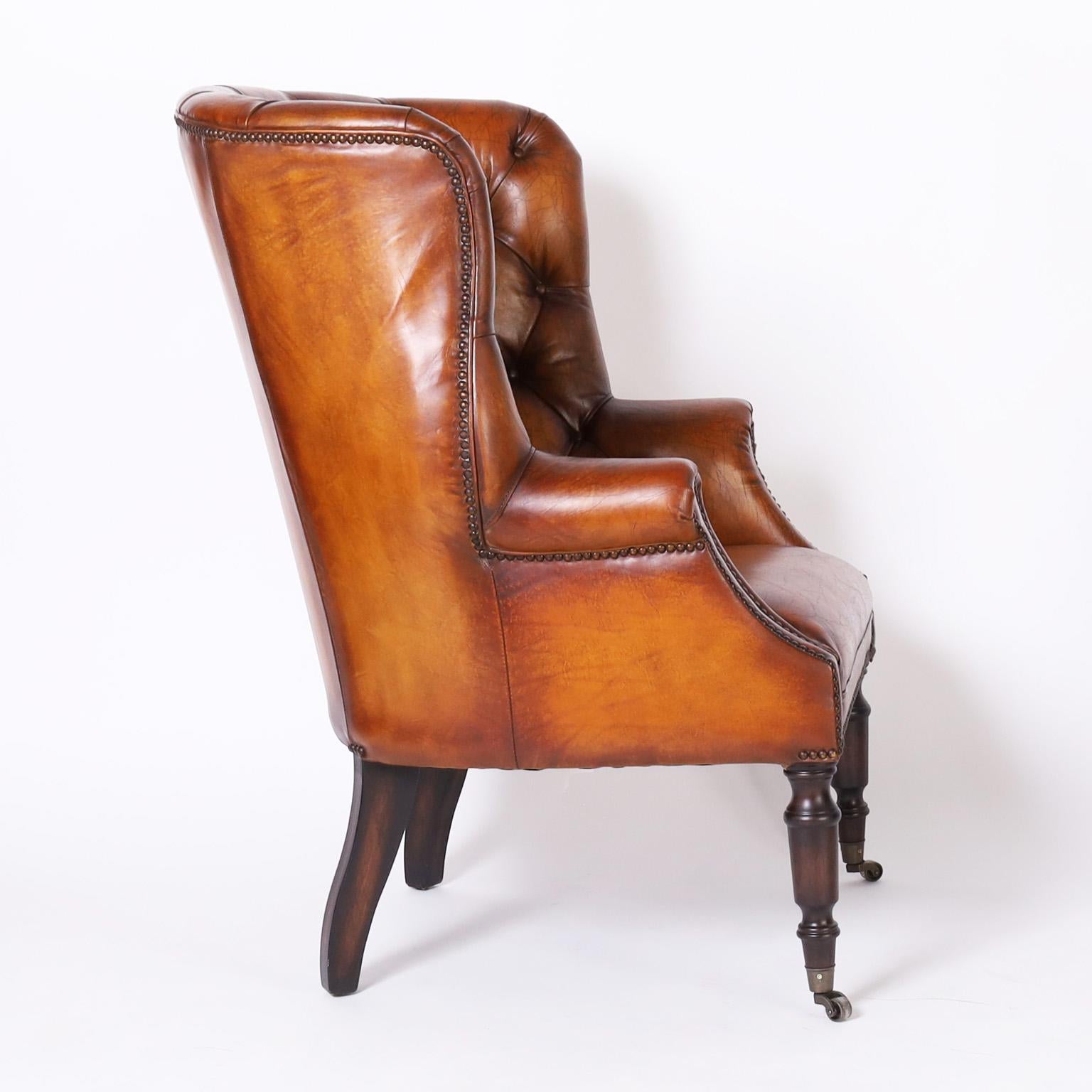 Hand-Crafted Pair of Leather Button Tufted Wingback British Colonial Style Armchairs For Sale