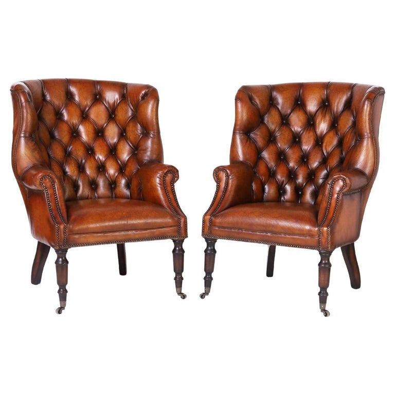 Pair of Leather Button Tufted Wingback British Colonial Style Armchairs