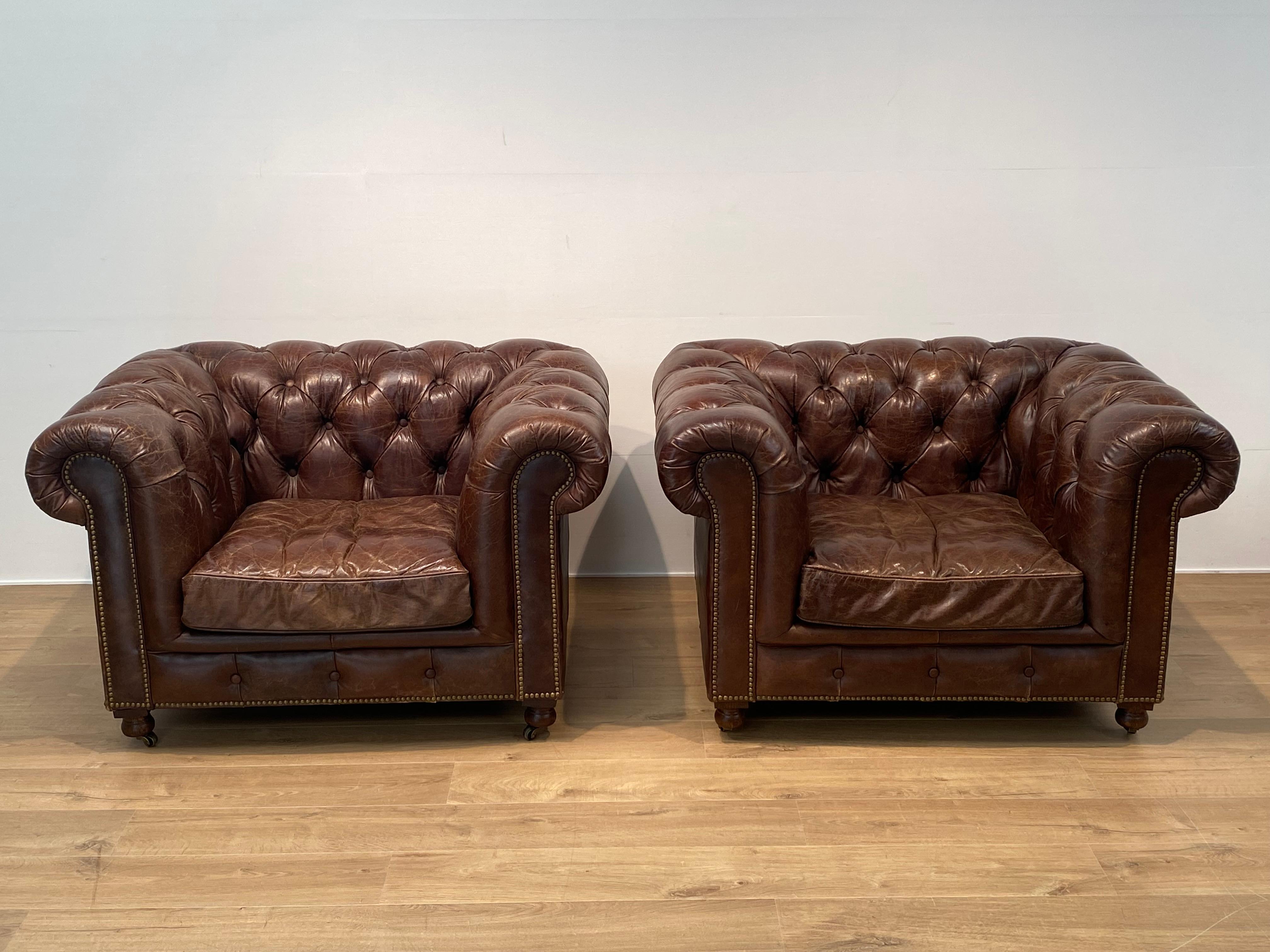 Patinated Pair of Leather Chesterfield Chairs For Sale