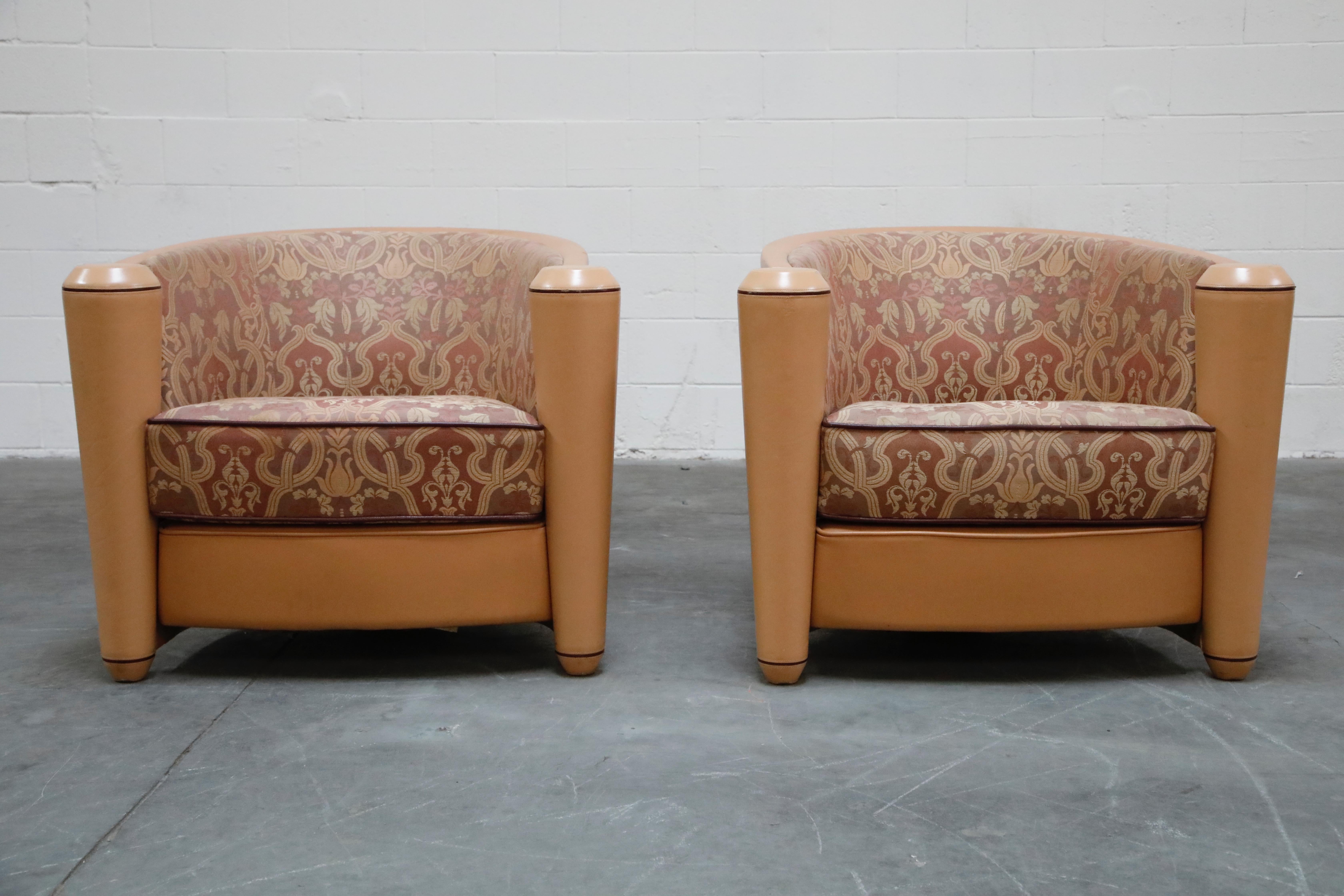 A fantastic pair of Post-Modern 1987 design with Art Deco styling 'Marnie' club chairs by Adam Tihany for i4 Mariani, originally retailed for over $9,000 each. These Italian tub chairs feature a deeply curved back with two conical shaped armrests