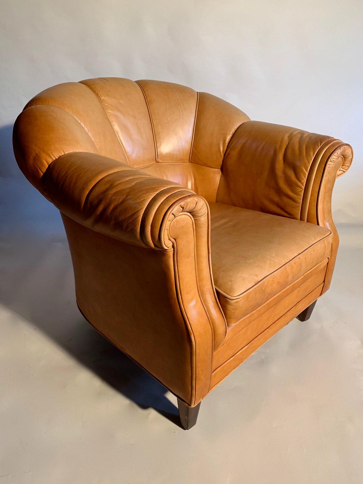 A pair of shell back Swedish Art Deco style Lounge chairs in cognac leather.
Fully sprung in the backs and seats, these chairs are very comfortable.
The leather has great detailing with the hand piping on the front profile.
The chairs are