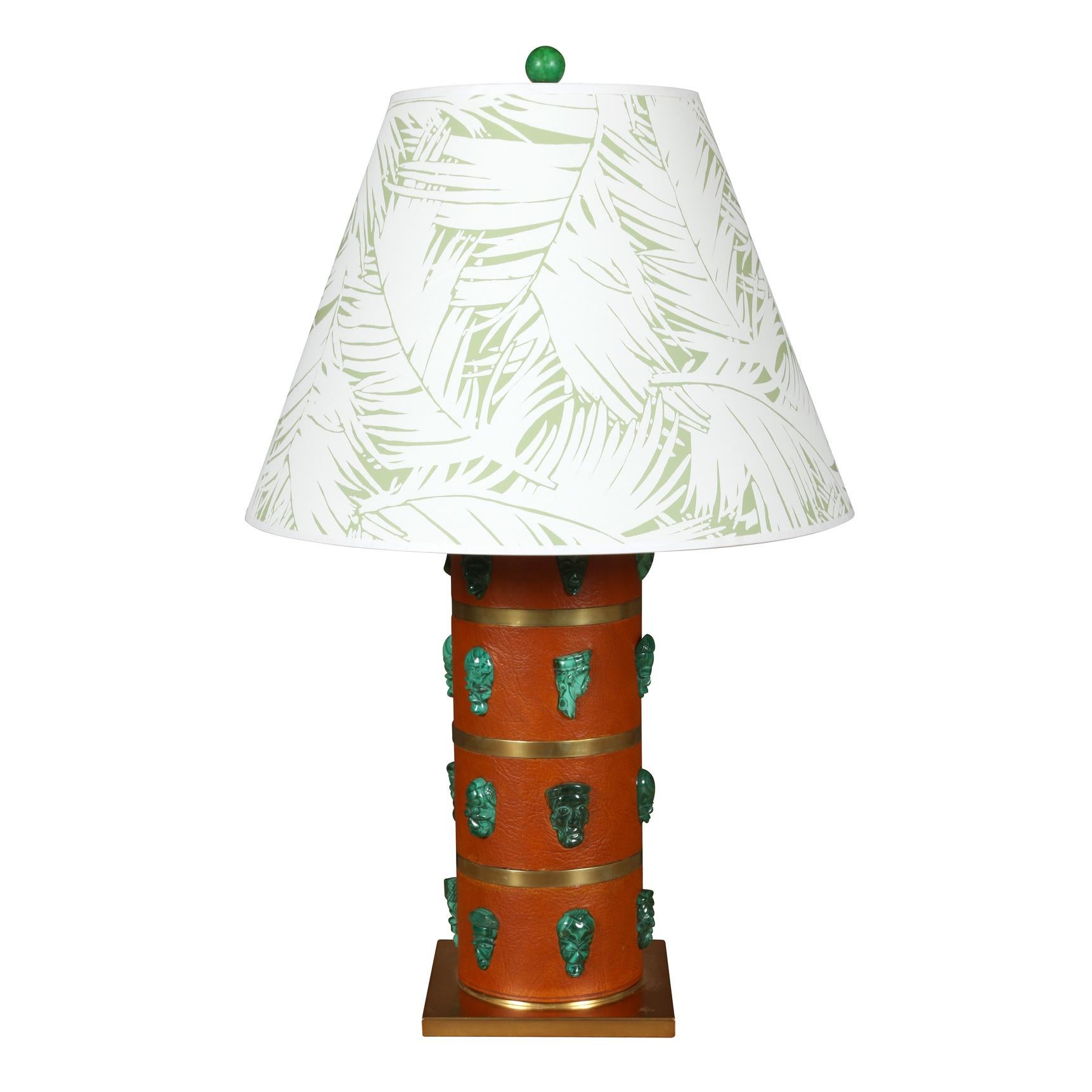A pair of leather cylindrical deep orange lamps on a square brass base with faux malachite details. Lampshades sold separately.