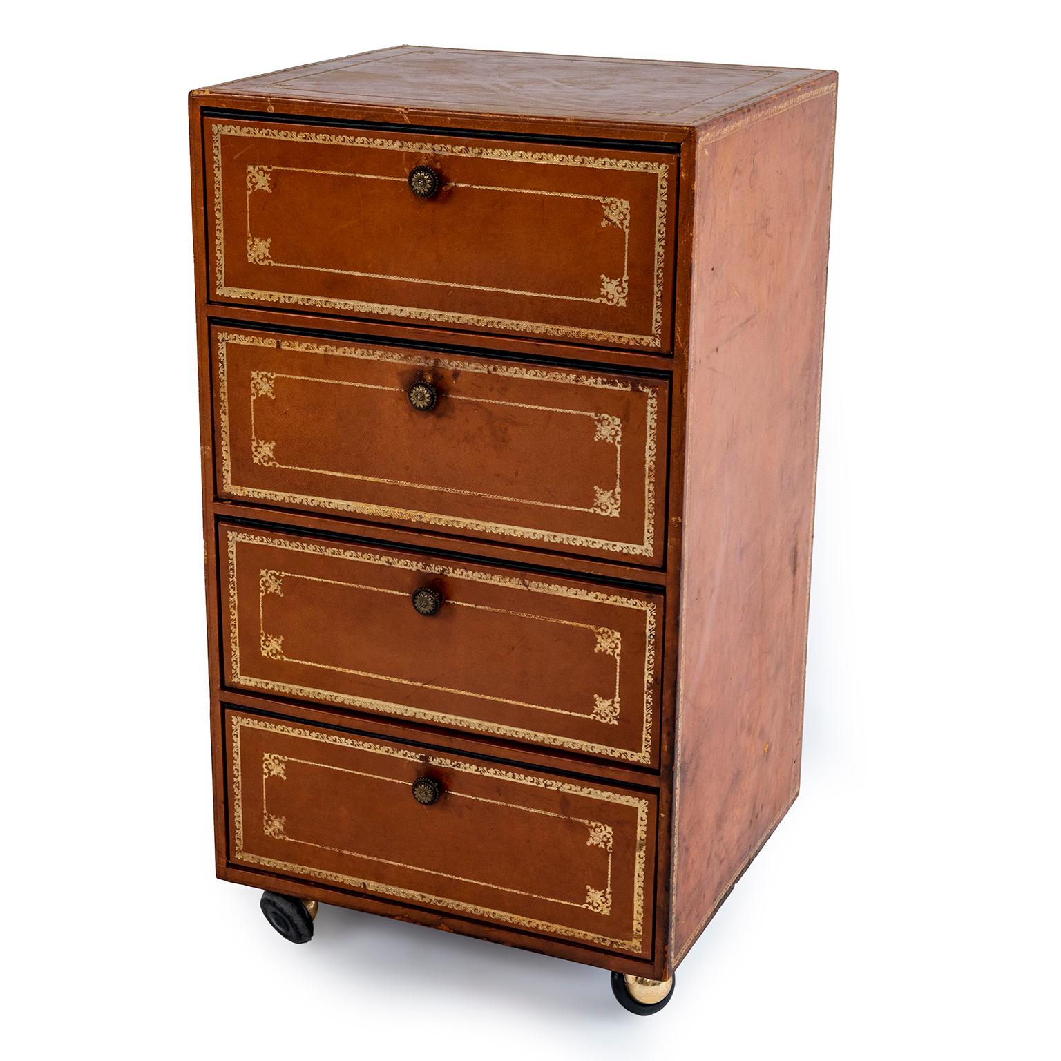 A pair of leather document cabinets or side tables on wheels. Each as 4 drawers, flap in front of each drawer pulls down. See images.