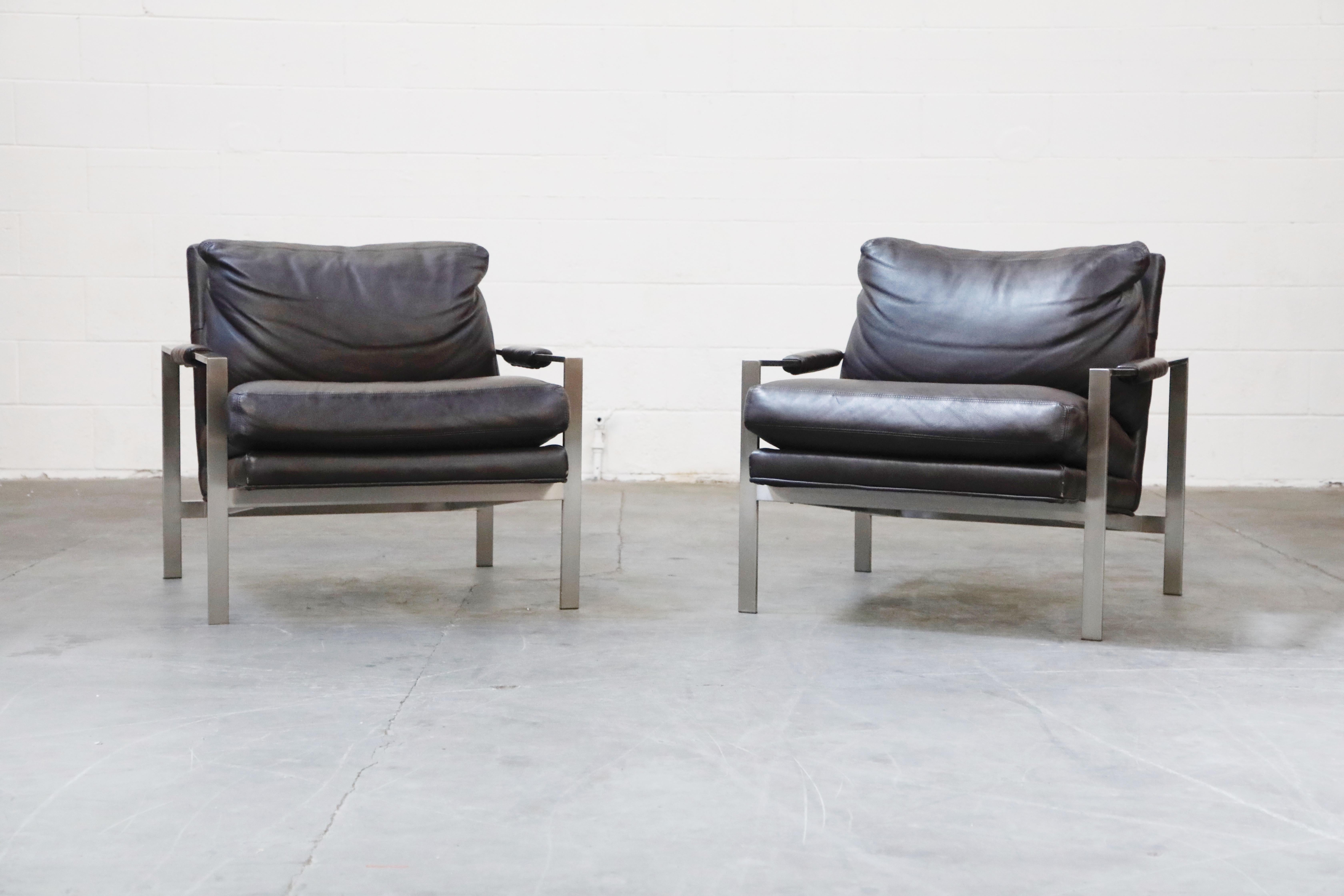 These beautiful stainless steel and full-grain leather lounge armchairs are by Milo Baughman for Thayer Coggin, designed in 1966, and produced by Thayer Coggin in High Point, North Carolina, made in the USA. High quality full-grain leather cushions