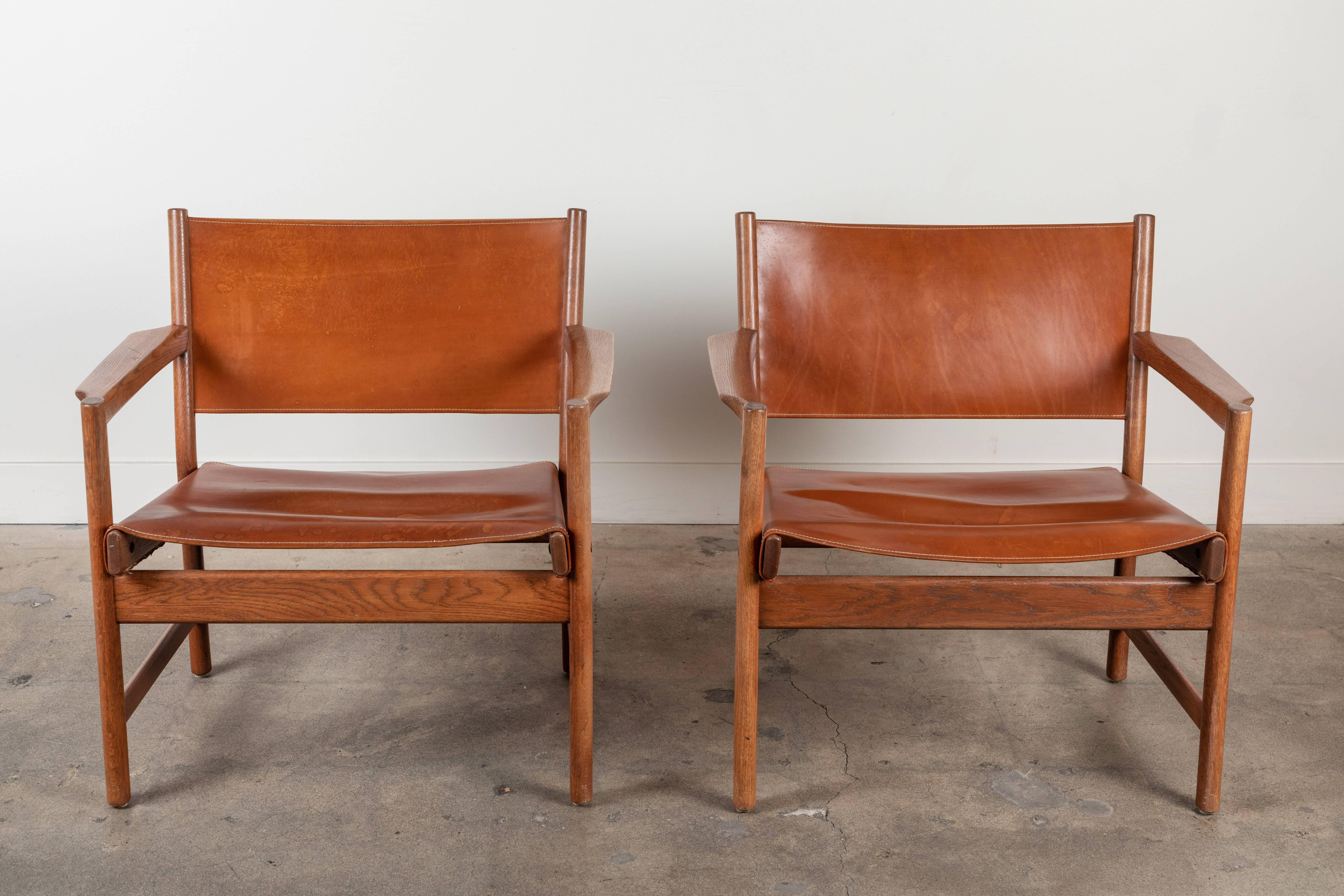 Pair of leather lounge chairs attributed to Gunnar Myrstrand.