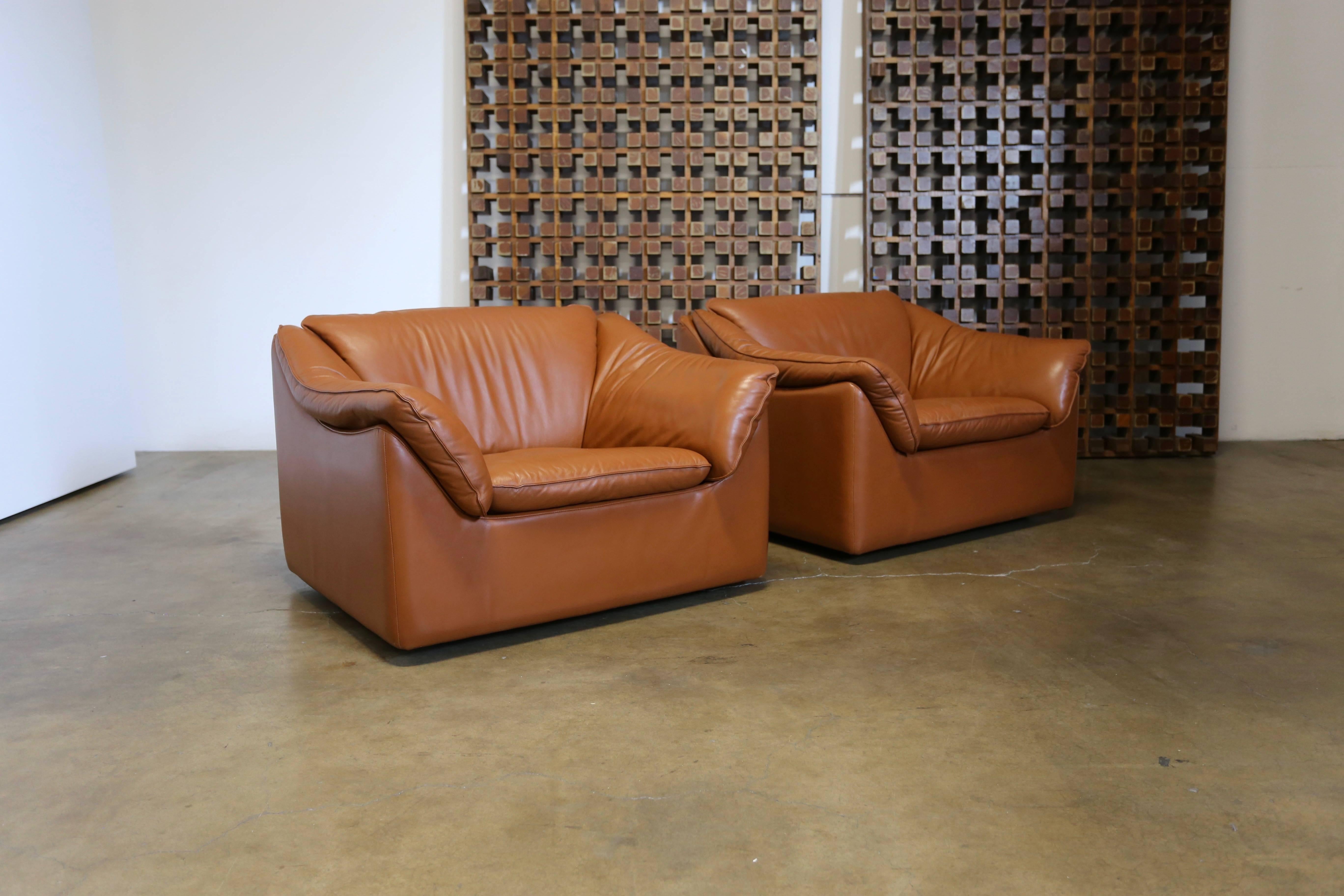 Pair of leather lounge chairs by Metropolitan Furniture Co.