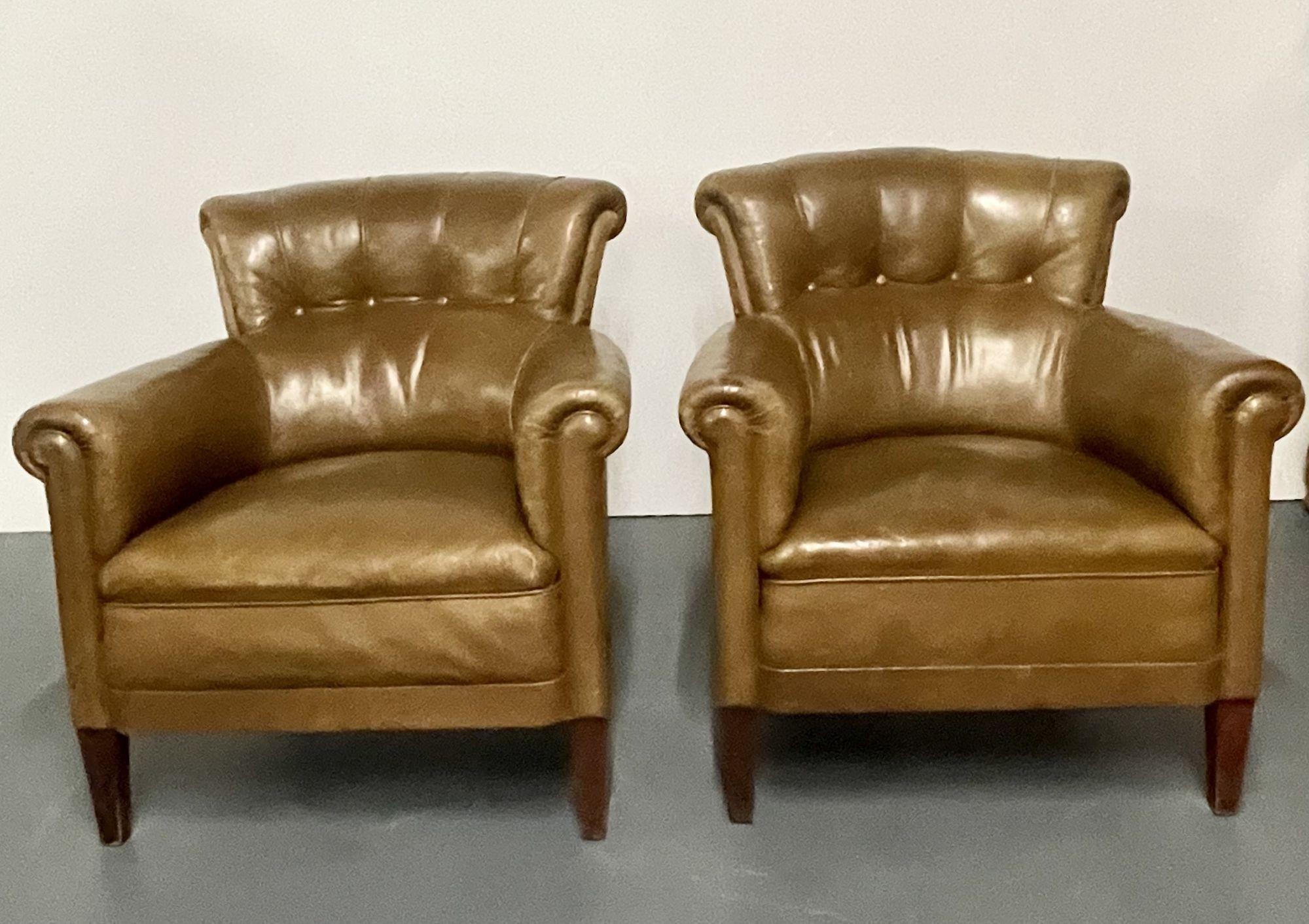 A Pair of Georgian Tuffted Leather Club, Lounge or Cigar Room Bergeres. Each in a fine worn brown leather on sprayed mahogany feet. The pair having a nice even aged worn look with button backs and oversized rolling arms. 
 
One chair with tear on