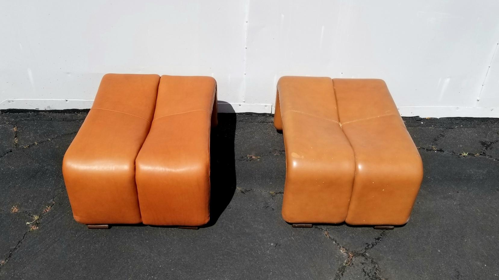 Ottoman is design in 1966 by Afra & Tobia Scarpa. This is a pair but one ottoman is new reupholstered so there is difference in color. We can sell them separately.