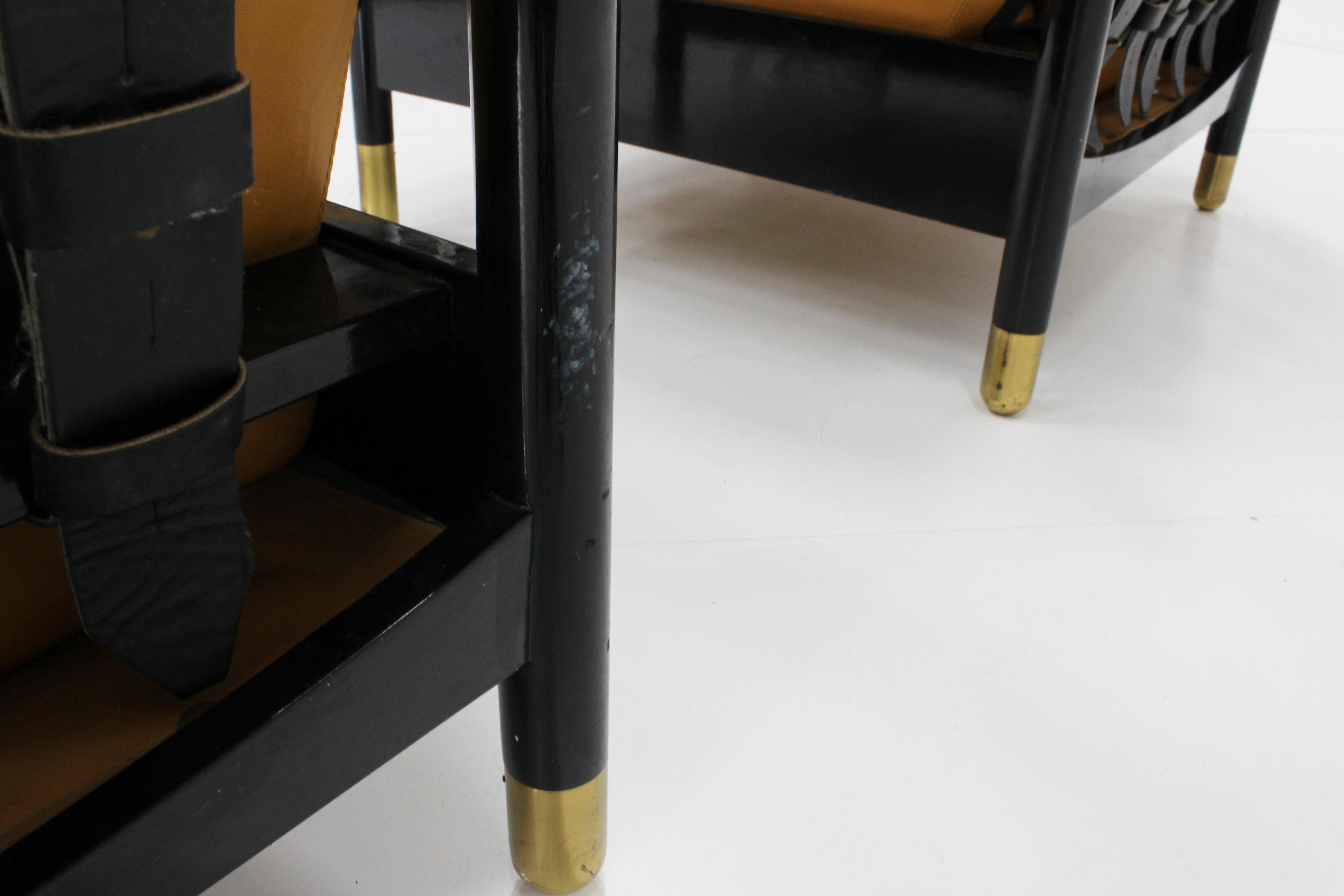 Pair of Leather Sella armchairs by Carlo de Carli for Sormani , Italy 1960s. 

Wooden structure with brass elements and leather straps. 

The leather is in a very good condition. The chairs have minor wear consistent with age as displayed in the