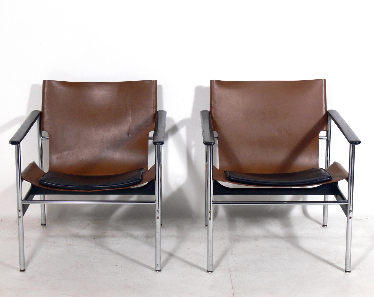 Pair of leather sling lounge chairs, designed by Charles Pollock for Knoll, American, circa 1960s. They retain their warm original patina to the original cognac leather sling seats.
