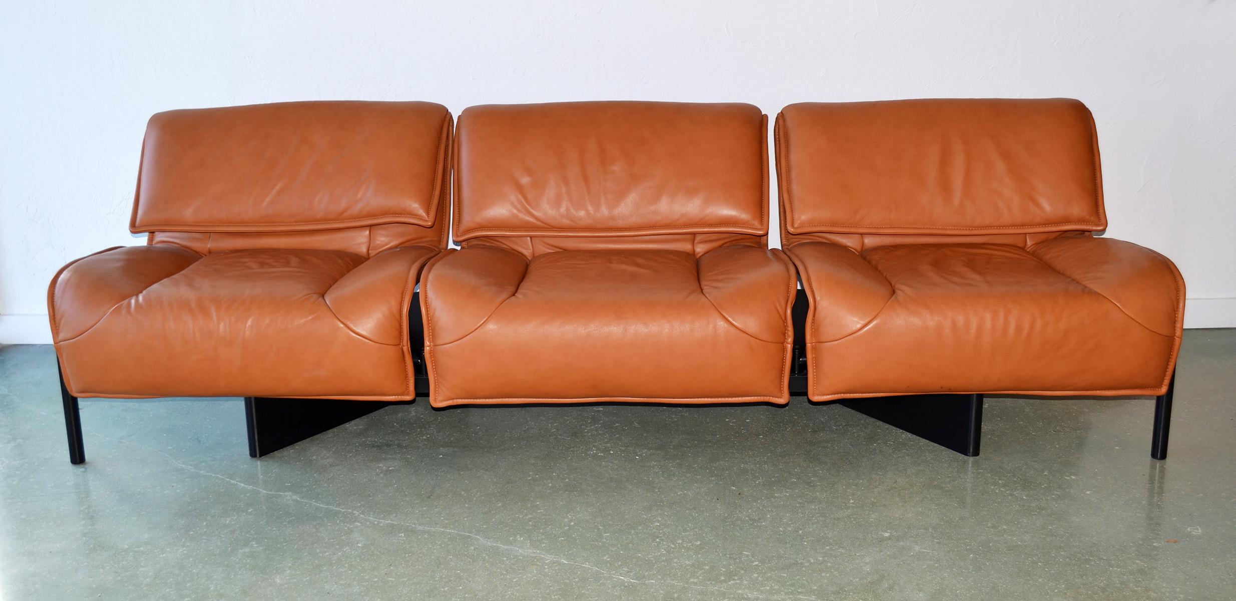 Pair of leather sofas or couches by Vico Magistretti for Cassina, Italy, 1980's. (ONE SHOWN) Designed by Vico Magistretti for Cassina, the Veranda sofas feature baseball glove leather with swiveling seats and adjustable headrests and metal legs on a