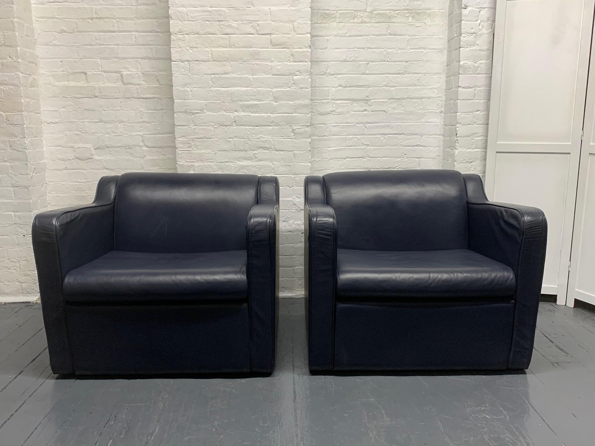Pair of leather (speed) lounge chairs. The leather is blue. Style of Paul Frankl speed chair.