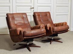 Pair of leather swivel lounge chairs by OPE-möbler Jönköping, Sweden, 1960s.