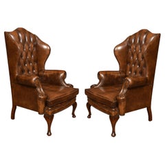 Antique Pair of Leather Upholstered Wingback Armchairs