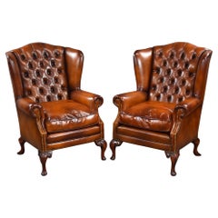 Antique Pair of Leather Wing Back Armchairs