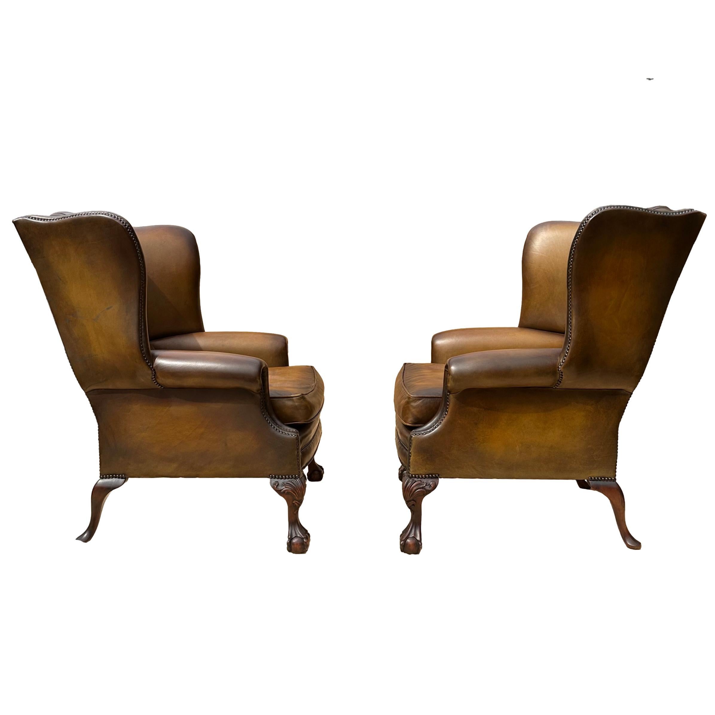 Edwardian Pair of Leather Wing Back Tufted Chairs on Ball & Claw Feet, English, ca. 1920. For Sale