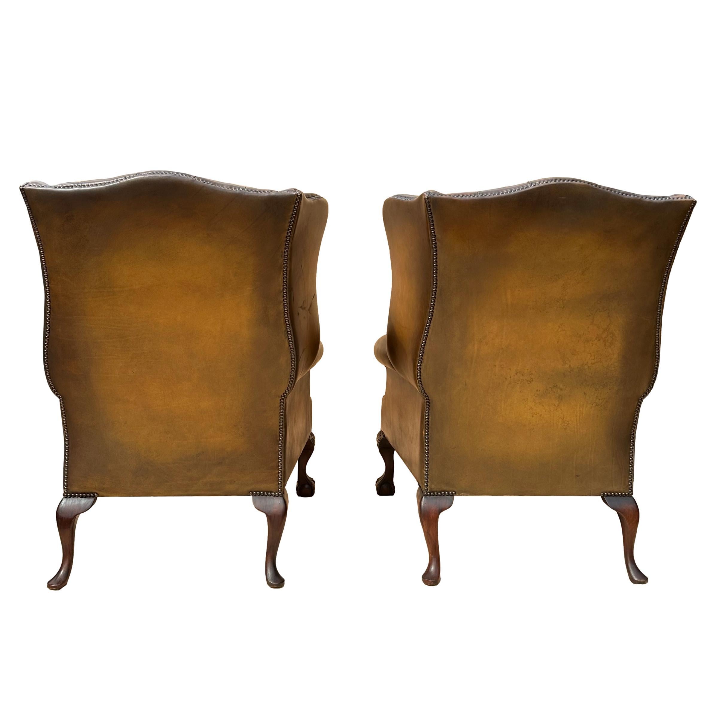 Pair of Leather Wing Back Tufted Chairs on Ball & Claw Feet, English, ca. 1920. In Good Condition For Sale In Banner Elk, NC