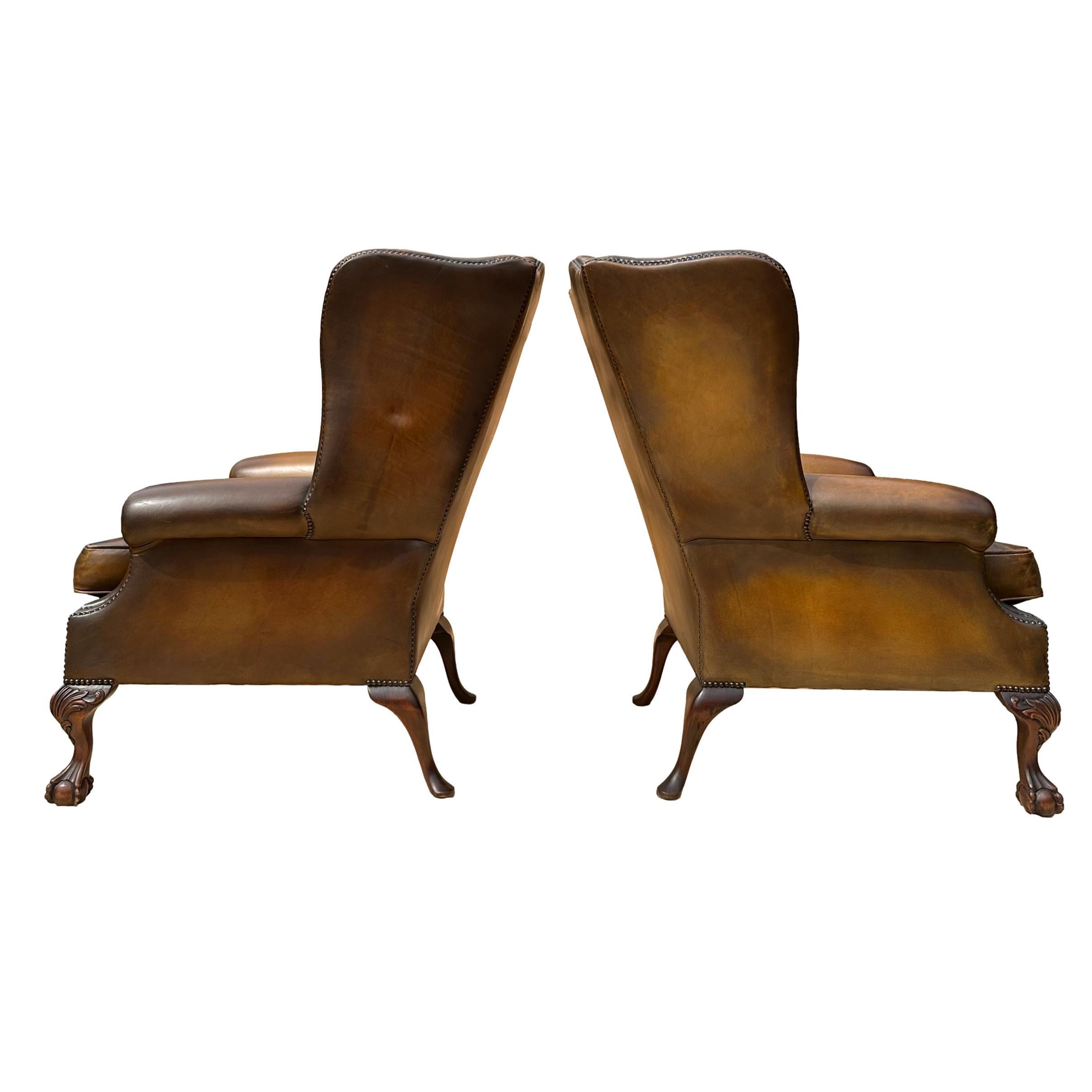20th Century Pair of Leather Wing Back Tufted Chairs on Ball & Claw Feet, English, ca. 1920. For Sale