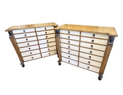 Pair of Neoclassical style leather wrapped chest of drawers