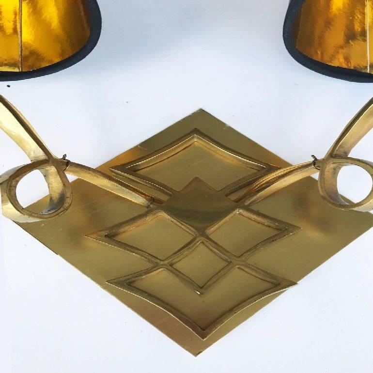 Superb pair of Jules Leleu style two-arm sconces custom brass backplate included US rewired and in working condition two lights, 60 watt max per light.
Have a look on our the largest collection of French and Italian Mid-Century period sconces, more