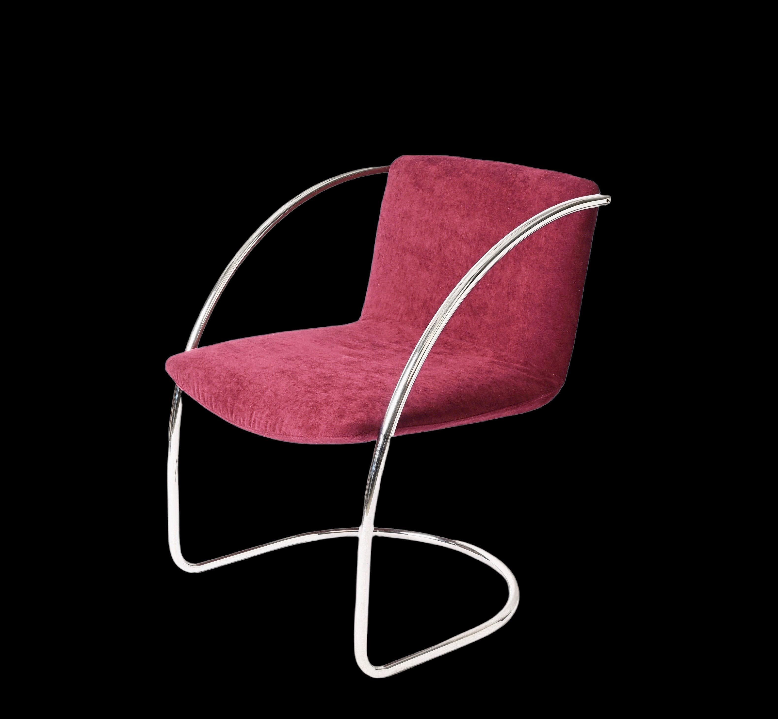 Marvellous midcentury pair of armchairs with tubular steel structure and plum fabric seats. 