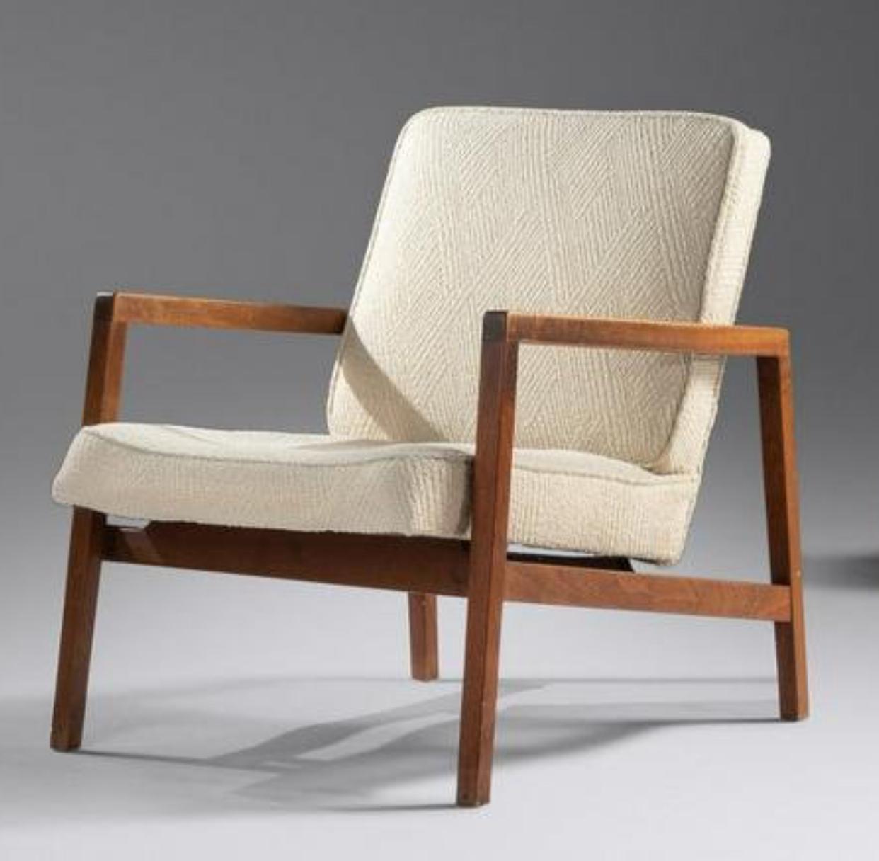 Pair of Lewis Butler for Knoll open arm longe chairs. Frames are a nicely grained walnut wood. The seats and back cushions are upholstered in an older textured pattern wool. The upholstery itself is in decent shape but the cushions have gone stiff.
