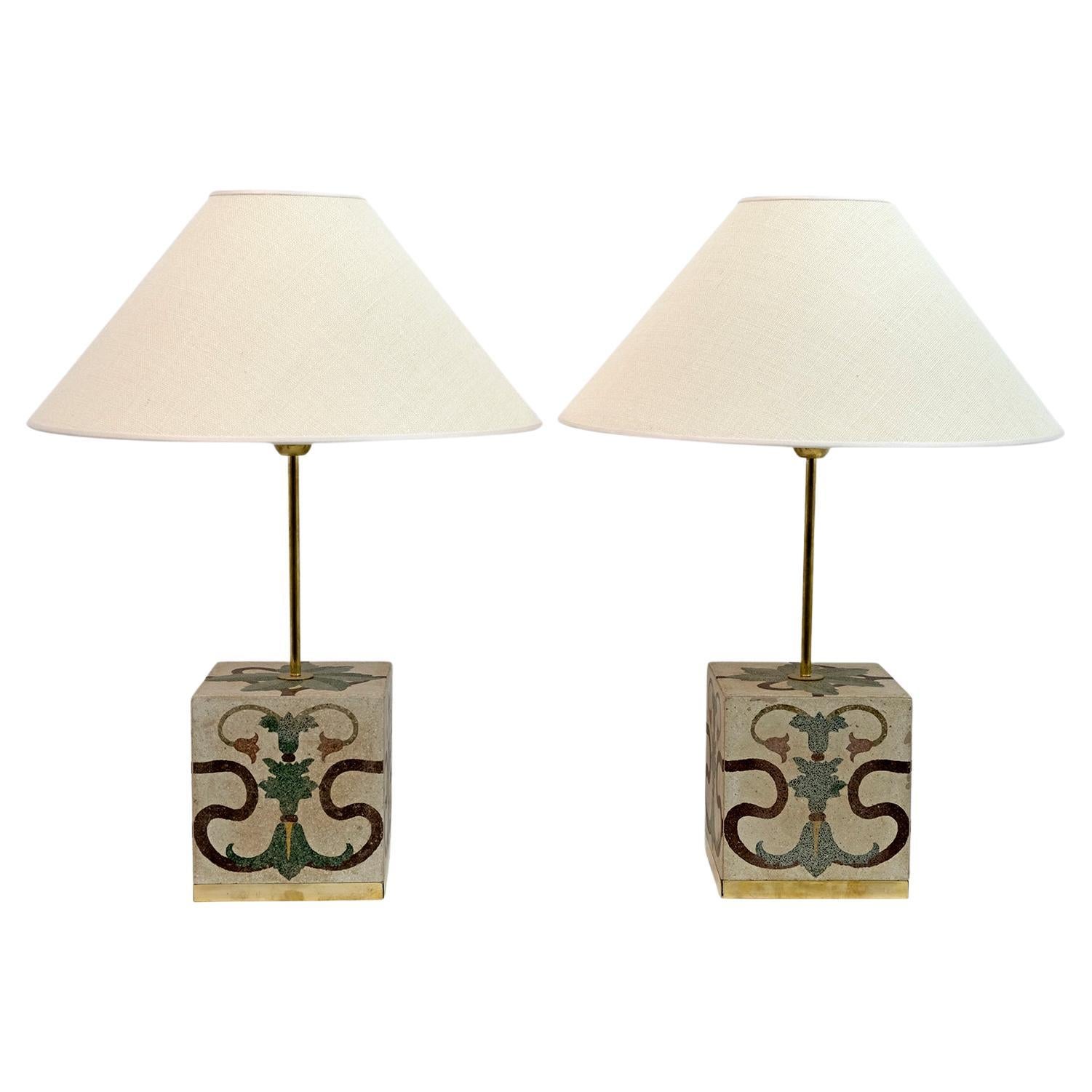 Pair of Italian Art Nouveau vintage cementite table lamps
The lamps were made in Italy in the 1920s using cement tiles with floral decorations typical of Art Nouveau, the frames on the base are in brass, including the attacks of the