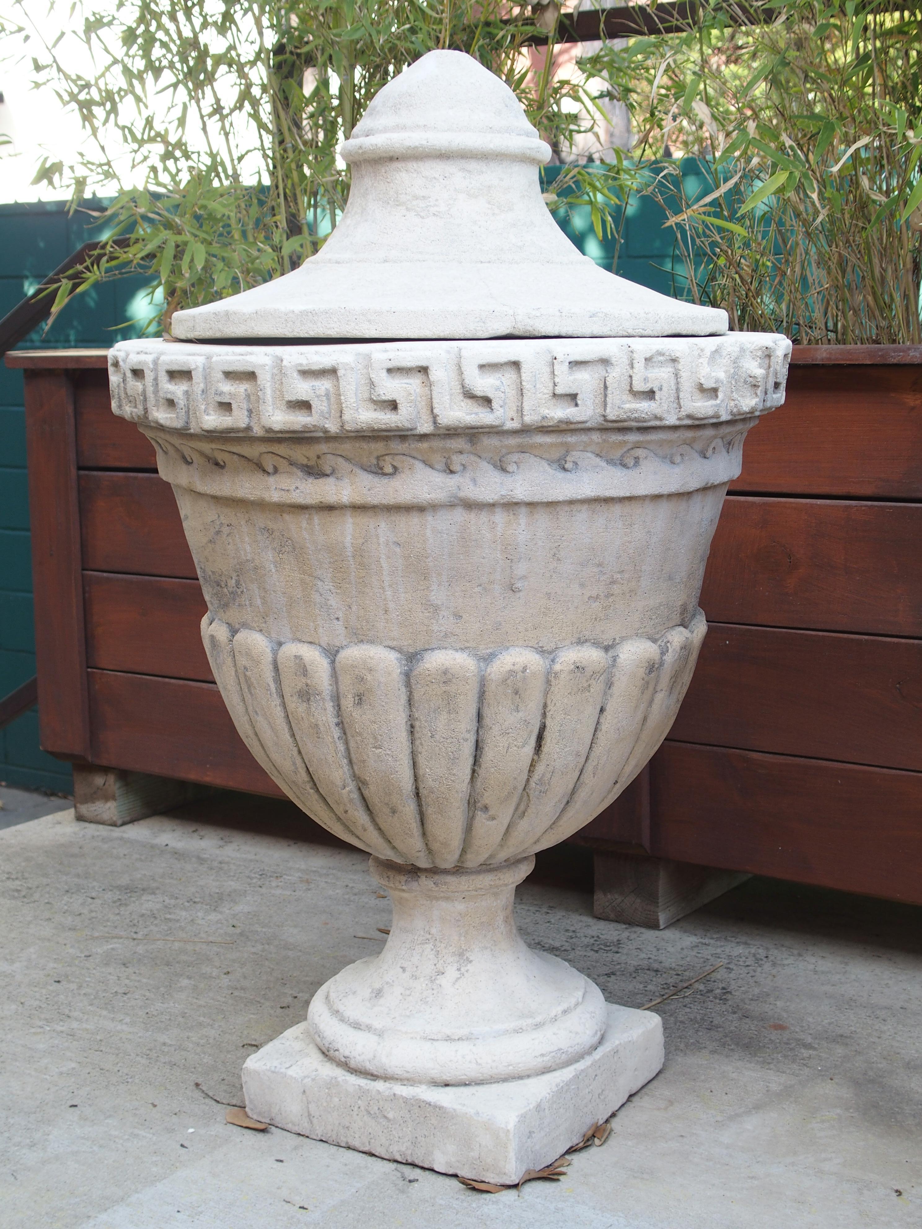 Neoclassical Pair of Lidded Cast Limestone Greek Key Urns from Southern Italy For Sale