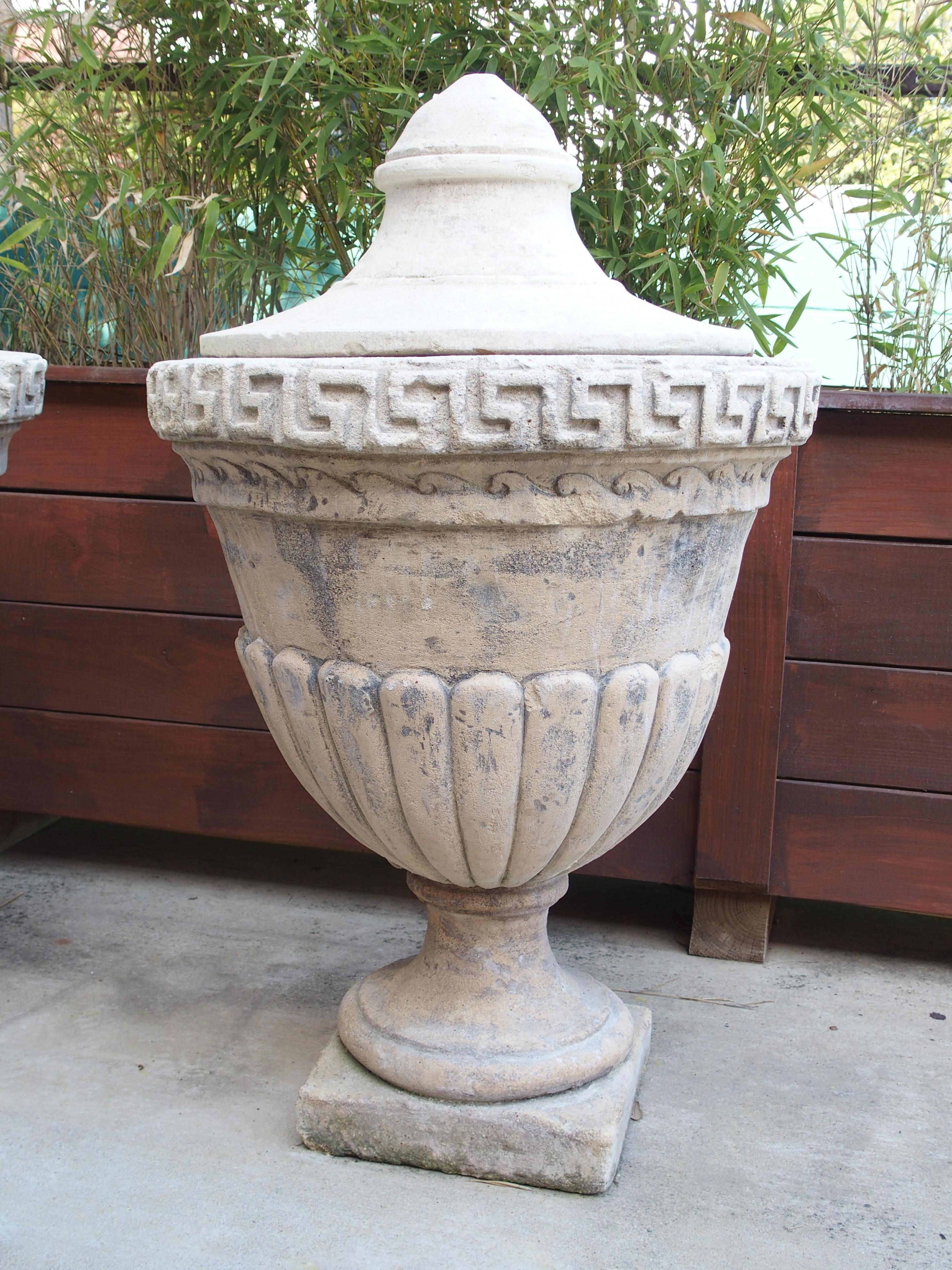 Italian Pair of Lidded Cast Limestone Greek Key Urns from Southern Italy For Sale