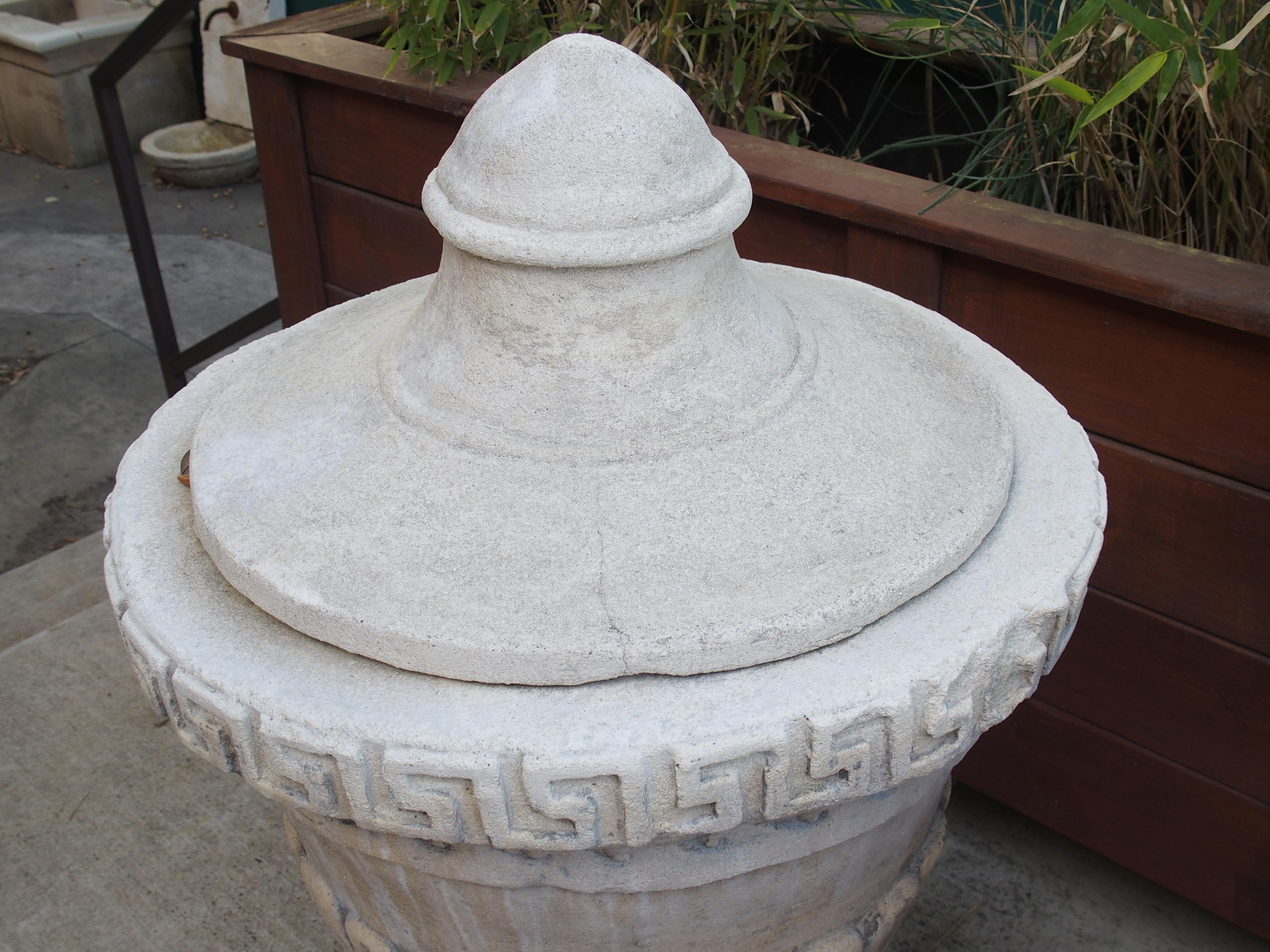 Pair of Lidded Cast Limestone Greek Key Urns from Southern Italy In Good Condition For Sale In Dallas, TX