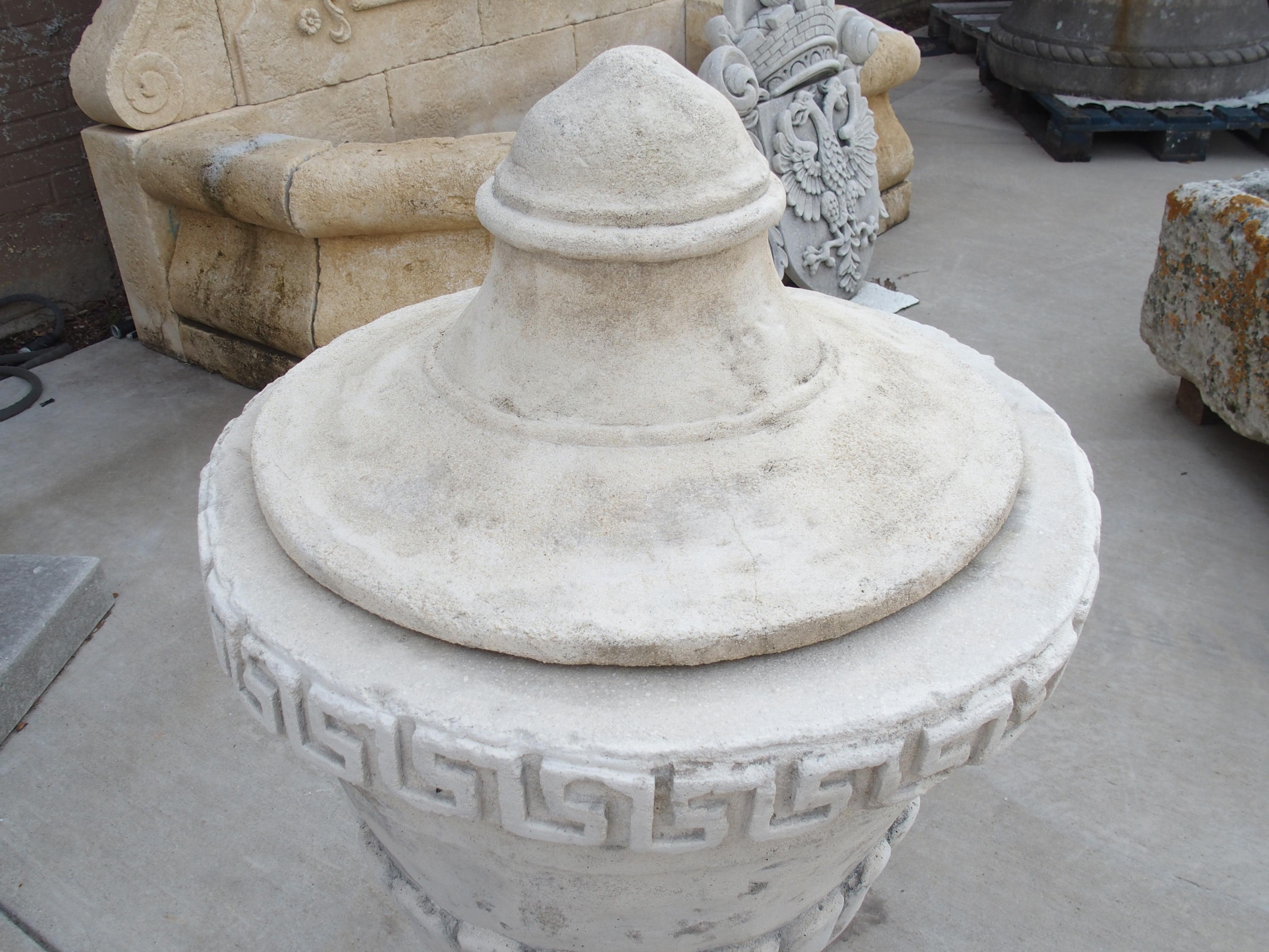 Pair of Lidded Cast Limestone Greek Key Urns from Southern Italy In Good Condition For Sale In Dallas, TX