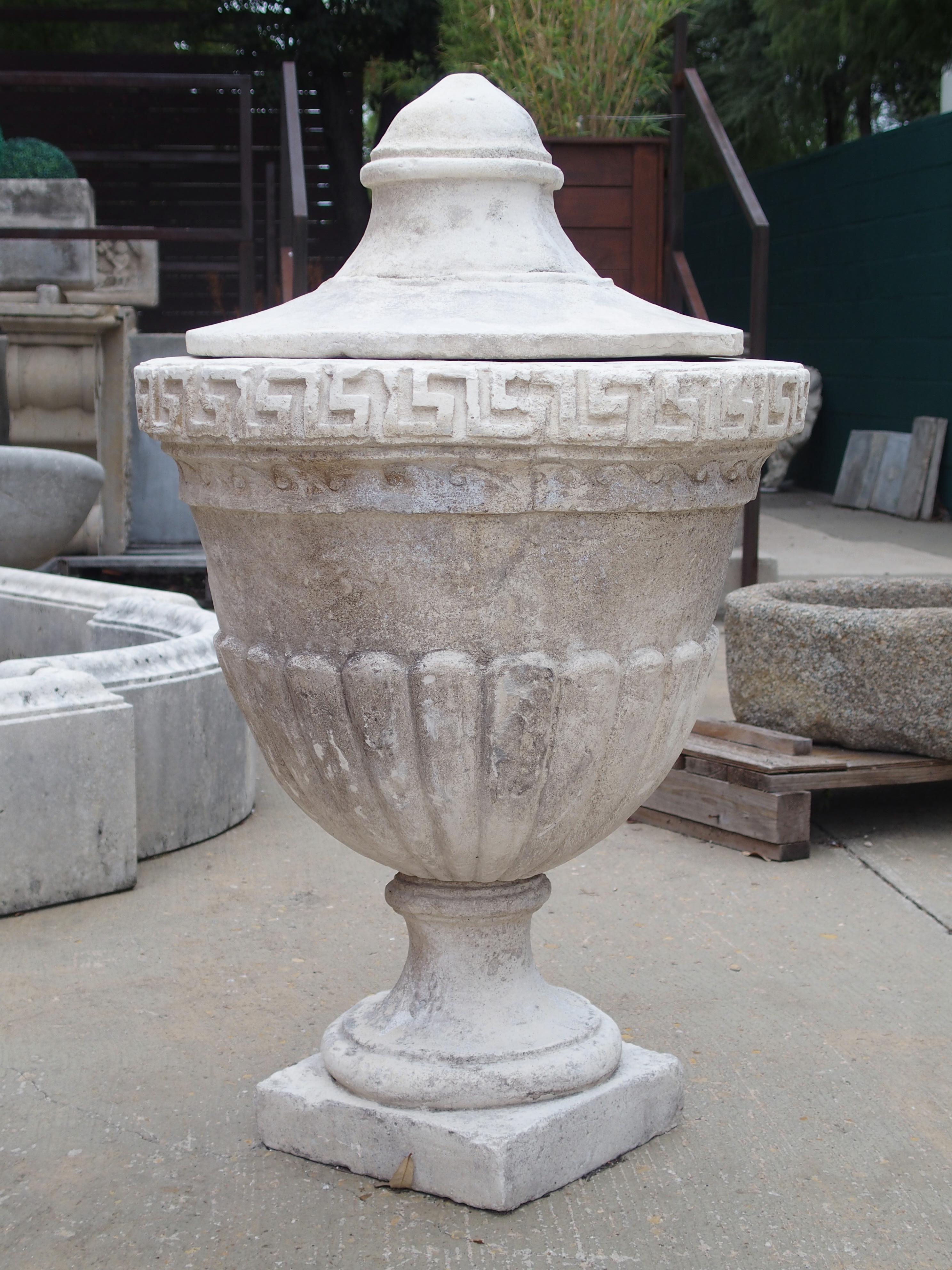 Contemporary Pair of Lidded Cast Limestone Greek Key Urns from Southern Italy