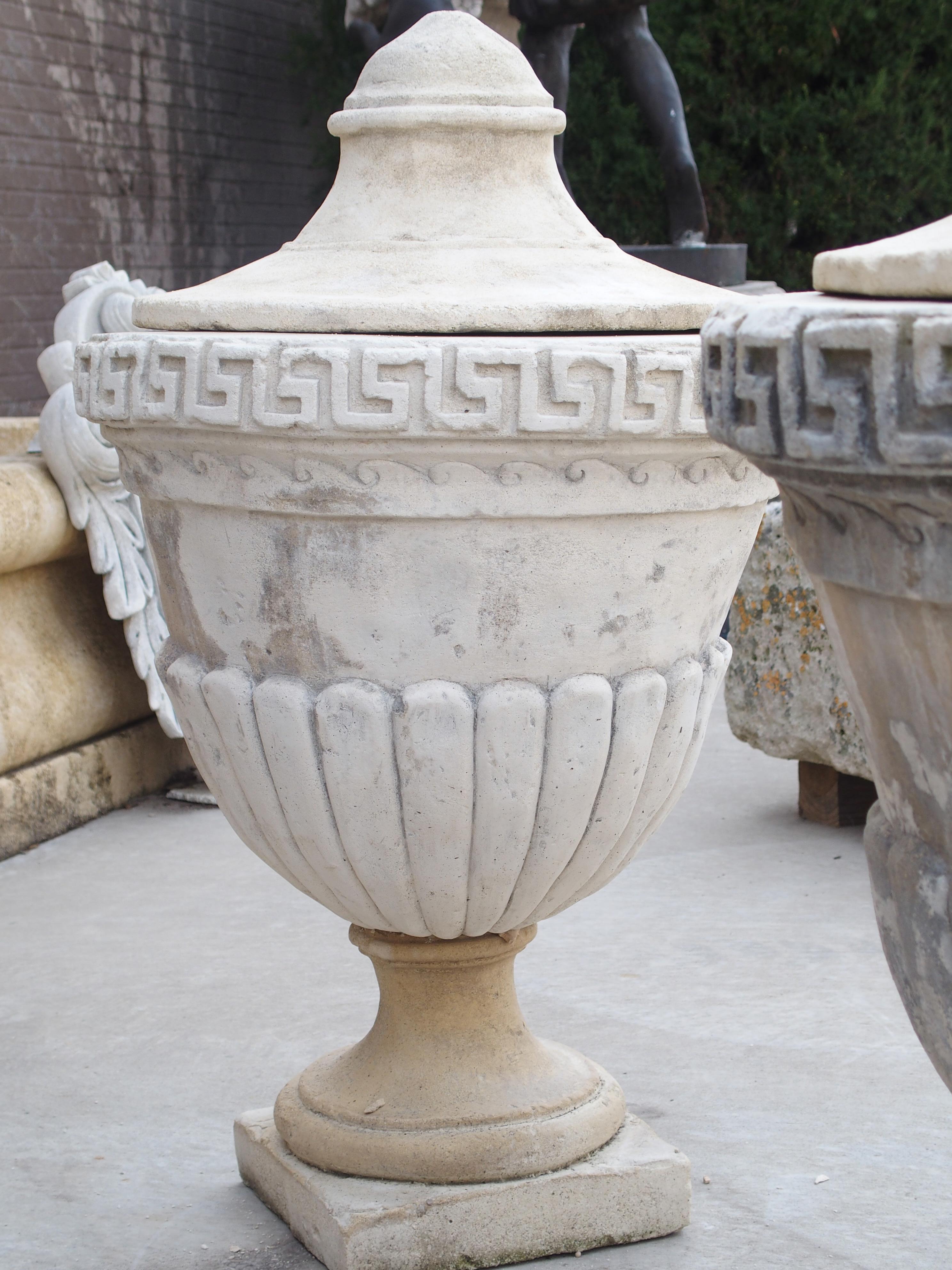 Stone Pair of Lidded Cast Limestone Greek Key Urns from Southern Italy