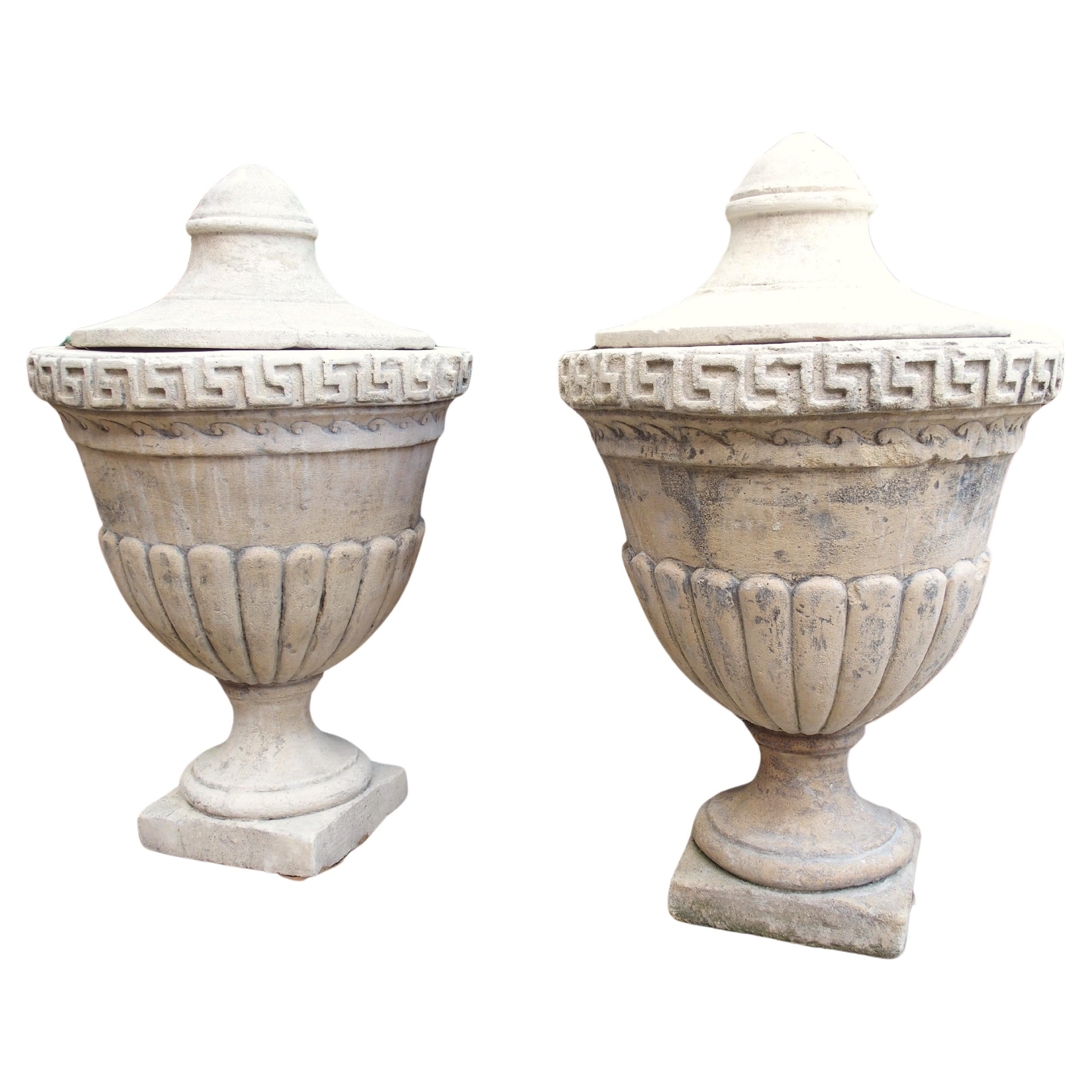 Pair of Lidded Cast Limestone Greek Key Urns from Southern Italy For Sale