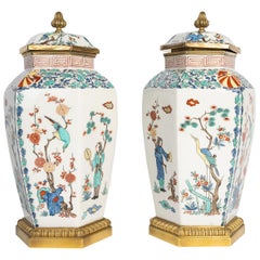 Pair Of Lidded Vases In Porcelain And Gilded Bronze, 20th Century.