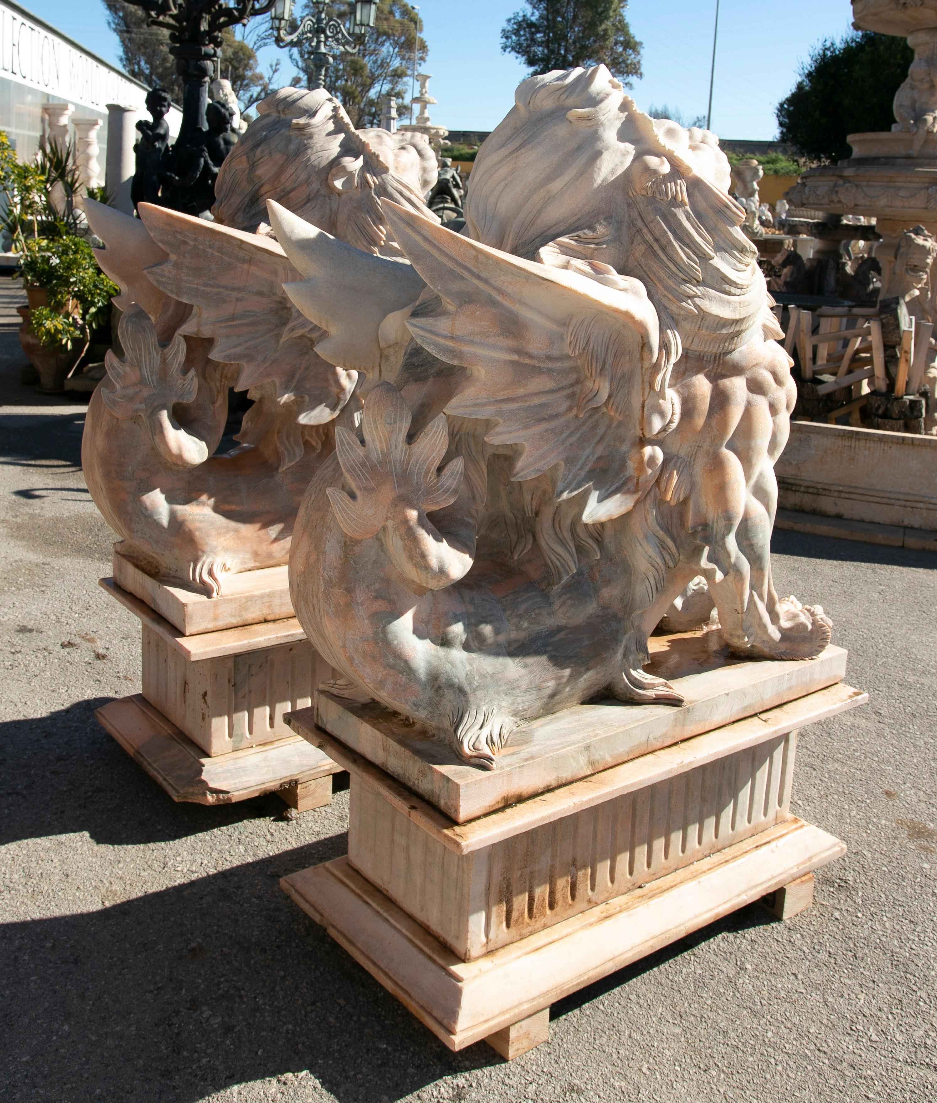 Pair of Life-Size 1990s Hand-Carved Rosetta Pink Marble Winged Lions w/ Bases In Good Condition In Marbella, ES