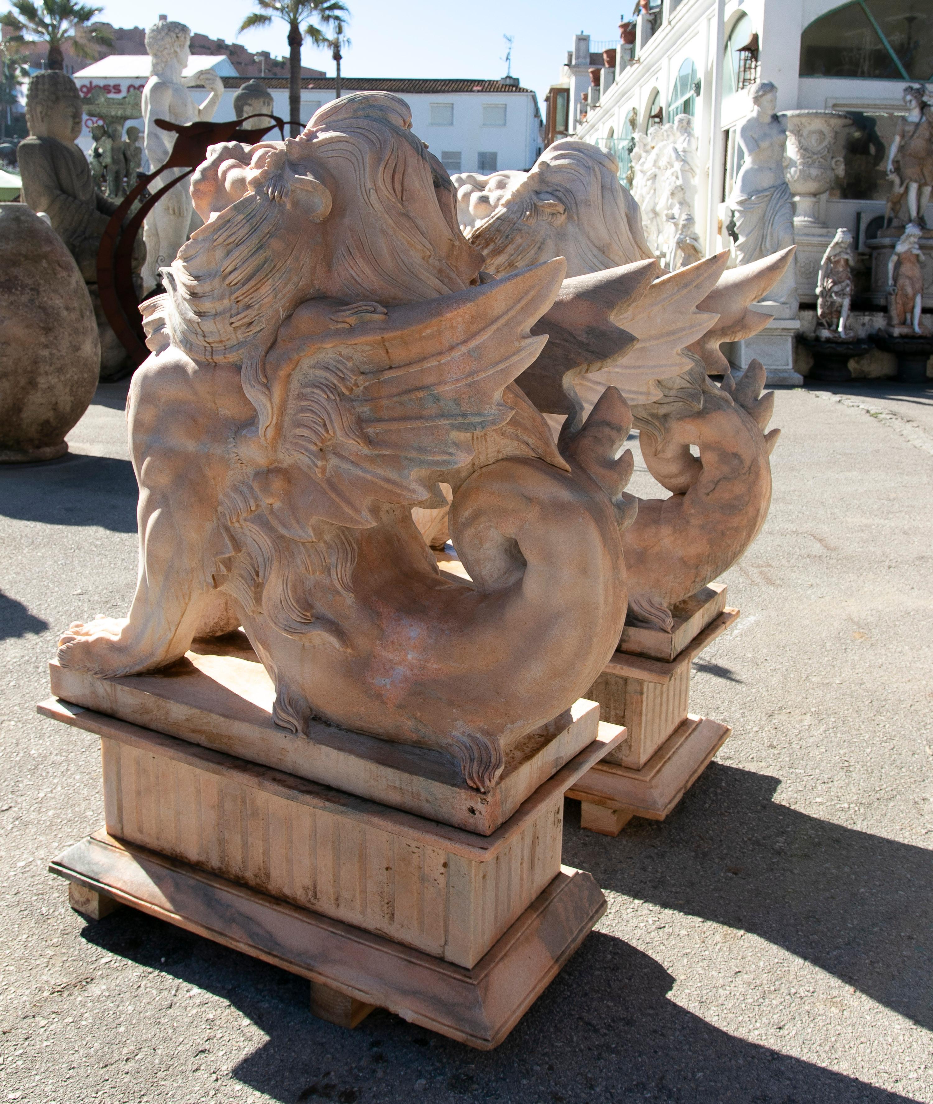 Pair of Life-Size 1990s Hand-Carved Rosetta Pink Marble Winged Lions w/ Bases 1