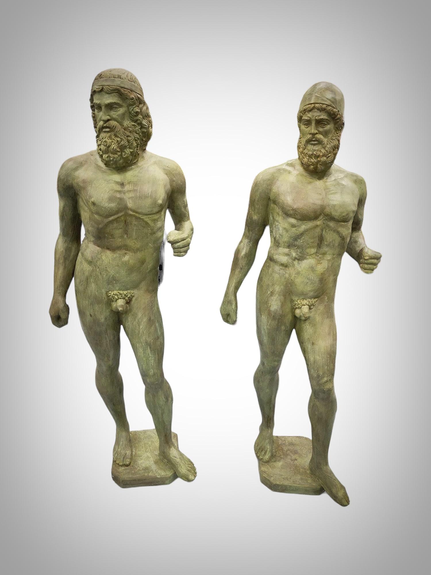 Product Description:

Material: Bronze
Height: 200 cm
Width: 60 cm
Depth: 40 cm
Signed by: P. Dubois
Era: 20th Century
Features and Details:
These impressive bronze sculptures depict a pair of the famous Riace Warriors, discovered in August 1972 by