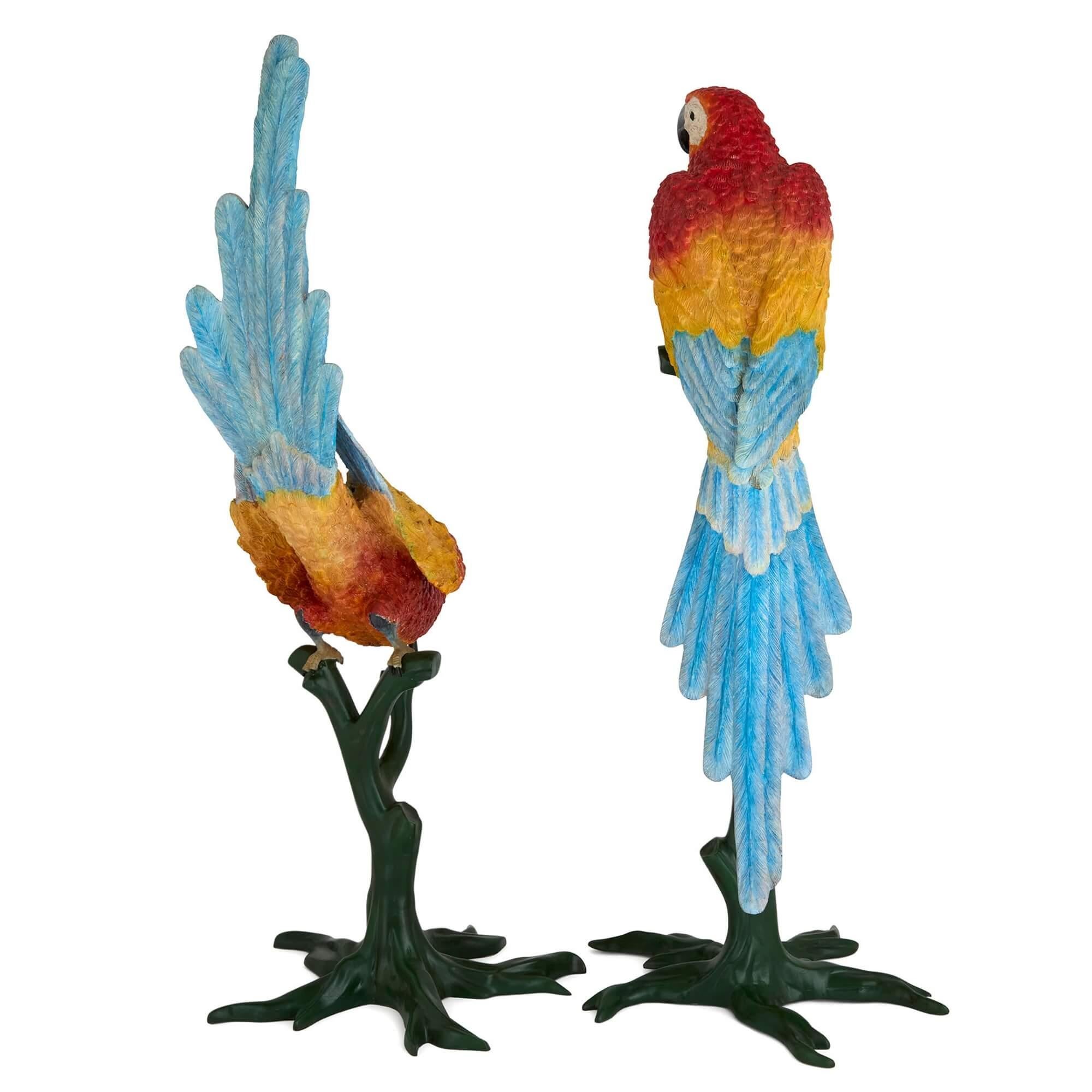 Pair of life-size painted bronze parrots 
Continental, 20th Century
Tallest: Height 141cm, width 50cm, depth 50cm
Smallest: Height 131cm, width 53cm, depth 50cm

Of a very impressive size, this charming pair of painted bronze parrots showcase the