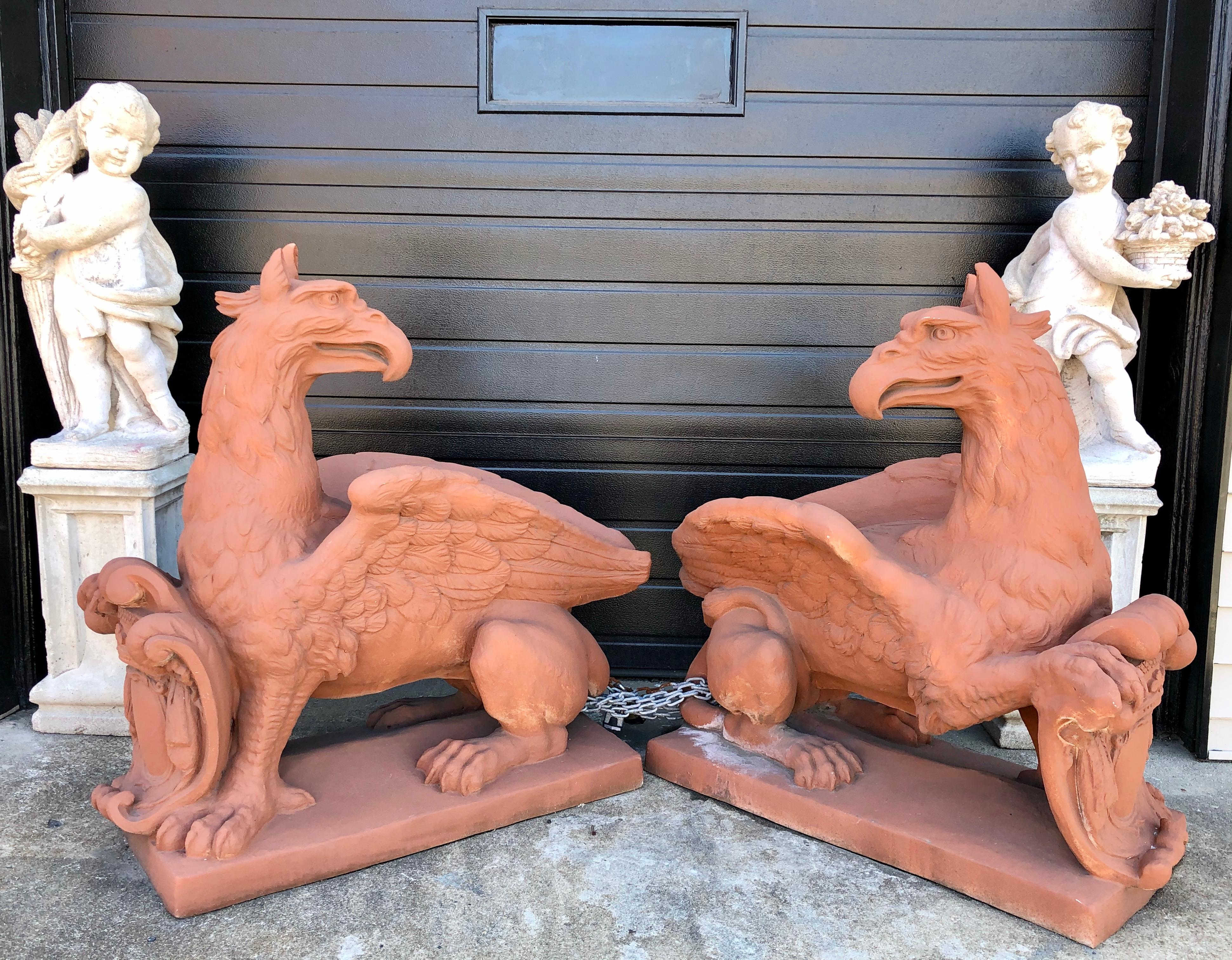 Pair of life sized terracotta gargoyles. Garden statues that appear so lifelike they actually scare you. These large and impressive sculptures can be placed inside or outside and can be painted to any color one likes.
