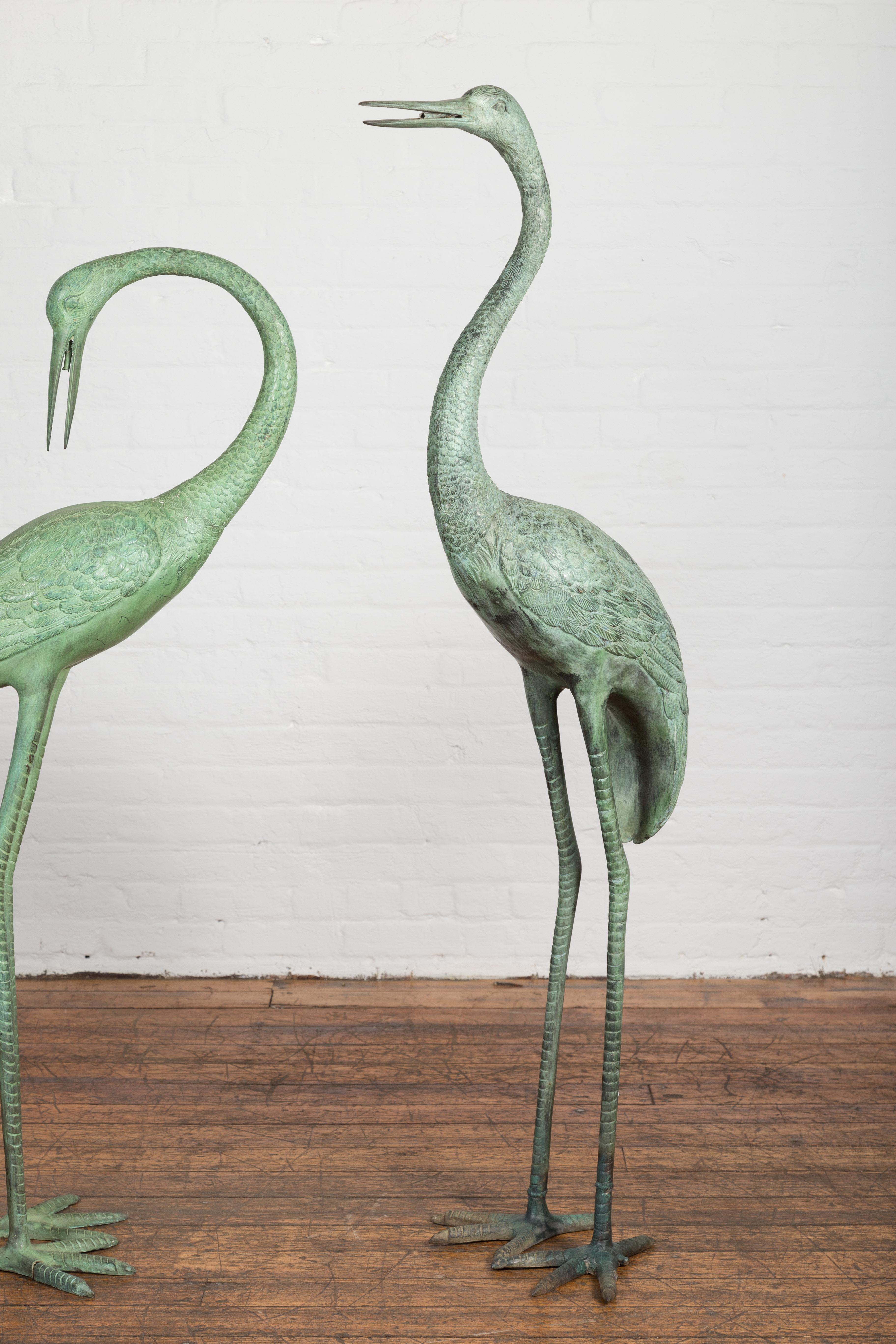 Pair of Lifesize Lost Wax Cast Bronze Crane Sculptures with Verdigris Patina In Excellent Condition For Sale In Yonkers, NY