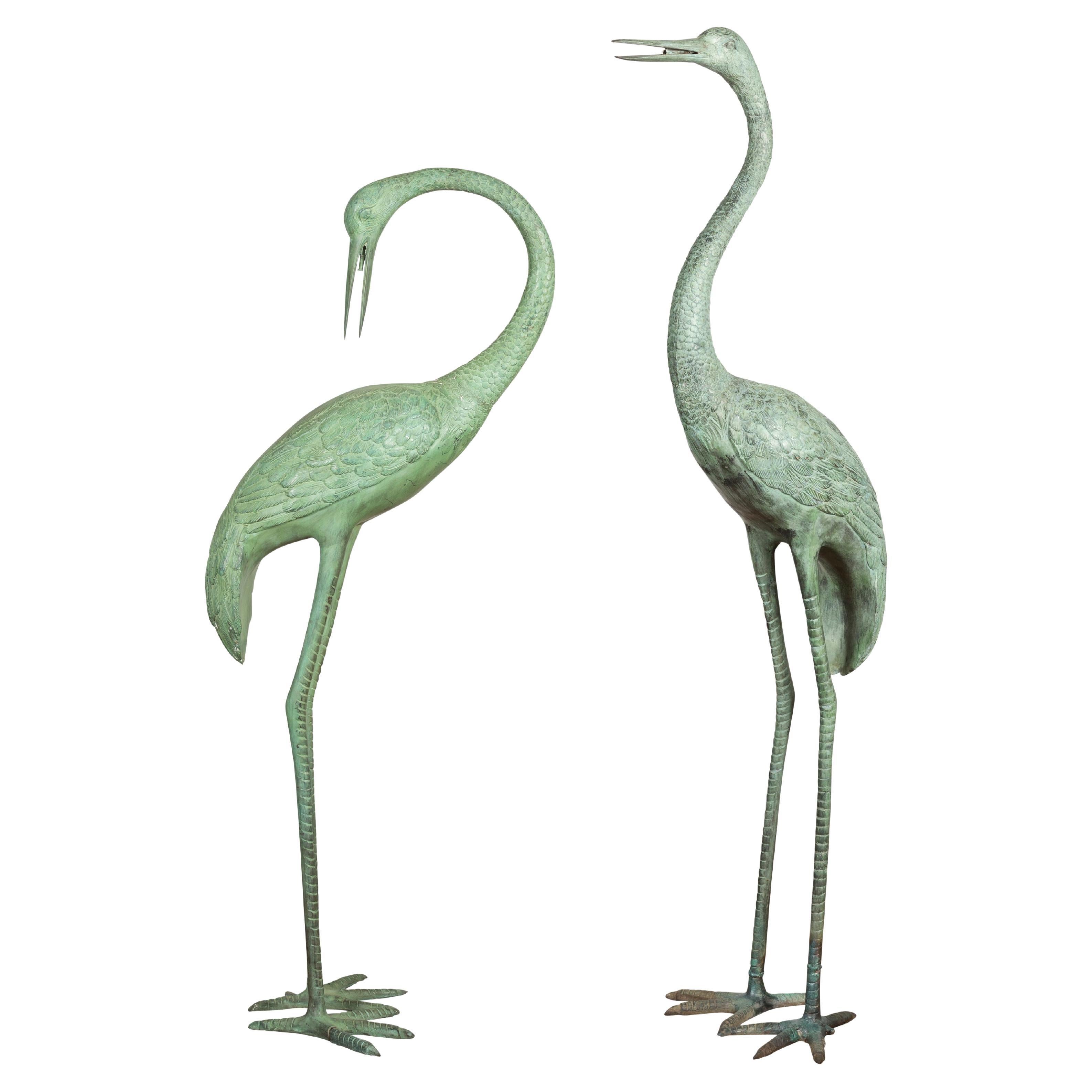 Pair of Lifesize Lost Wax Cast Bronze Crane Sculptures with Verdigris Patina For Sale