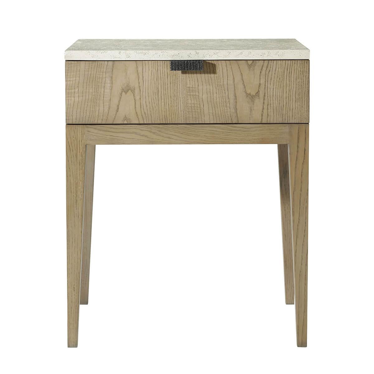 A modern single drawer nightstand perfect for any bedroom. Seen here in clean-cut figured ash in our light Dune finish with a textured metal pull in Ember finish. Completed with a stone-like porous top in our exclusive Mineral finish.

Dimensions: