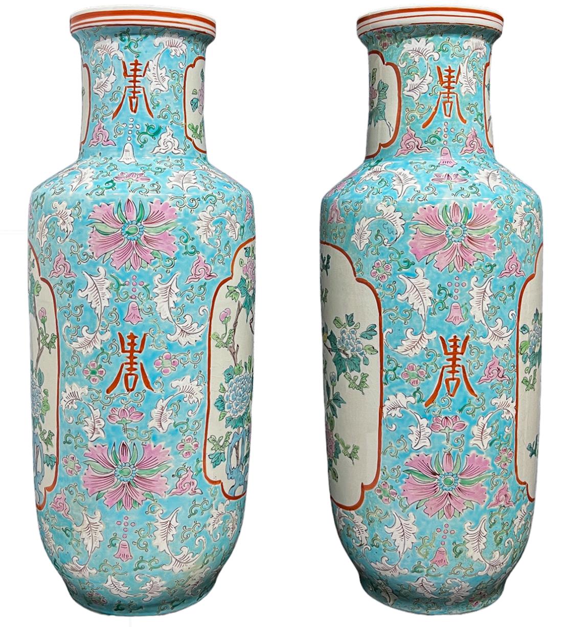 A fabulous set of large baby blue Chinese porcelain picture vases. A small blue and yellow canary is perched on a sparse blue and pink hydrangea bush. The central composition is surrounded by that dreamy light blue, pink flowers, scroll form stems