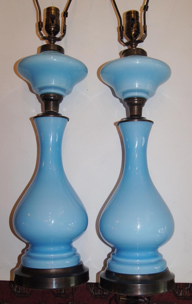 Pair of circa 1900s French opaline glass table lamps with metal base.
Measurements
Height of body: 20?
Height to rest of shade: 31?.