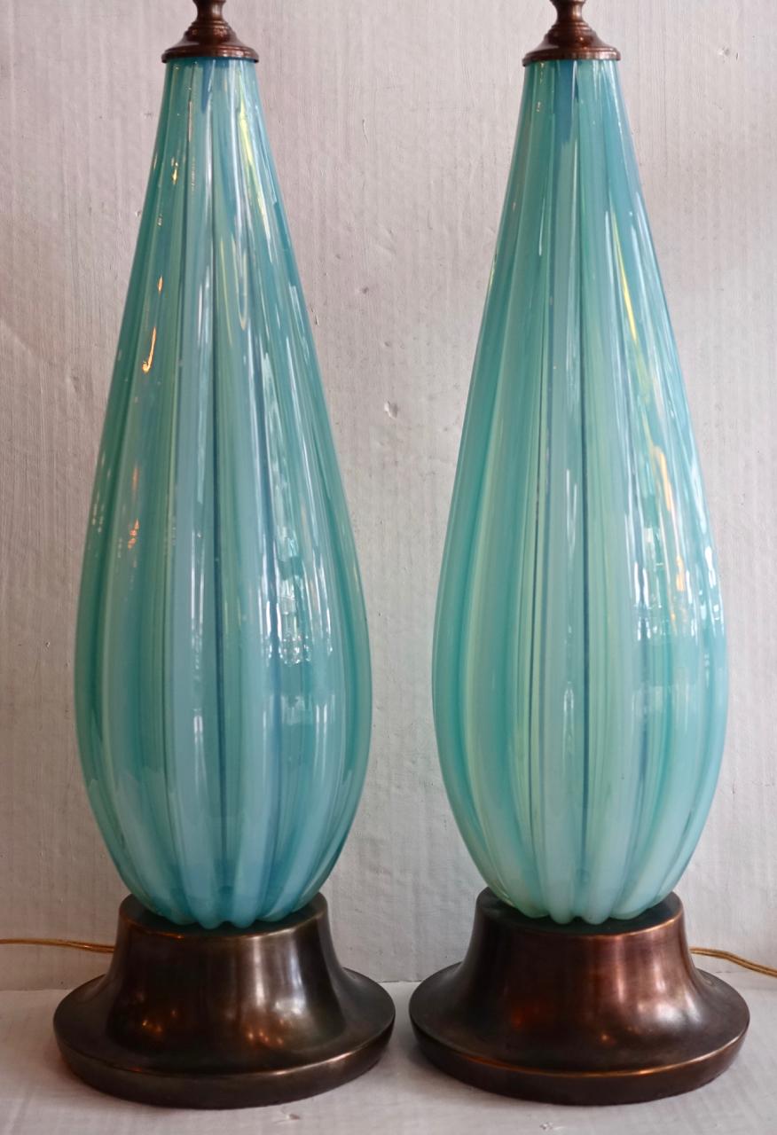 Pair of 1920s Venetian glass Murano table lamps with metal bases.

Measures:
Height of body: 20.5
