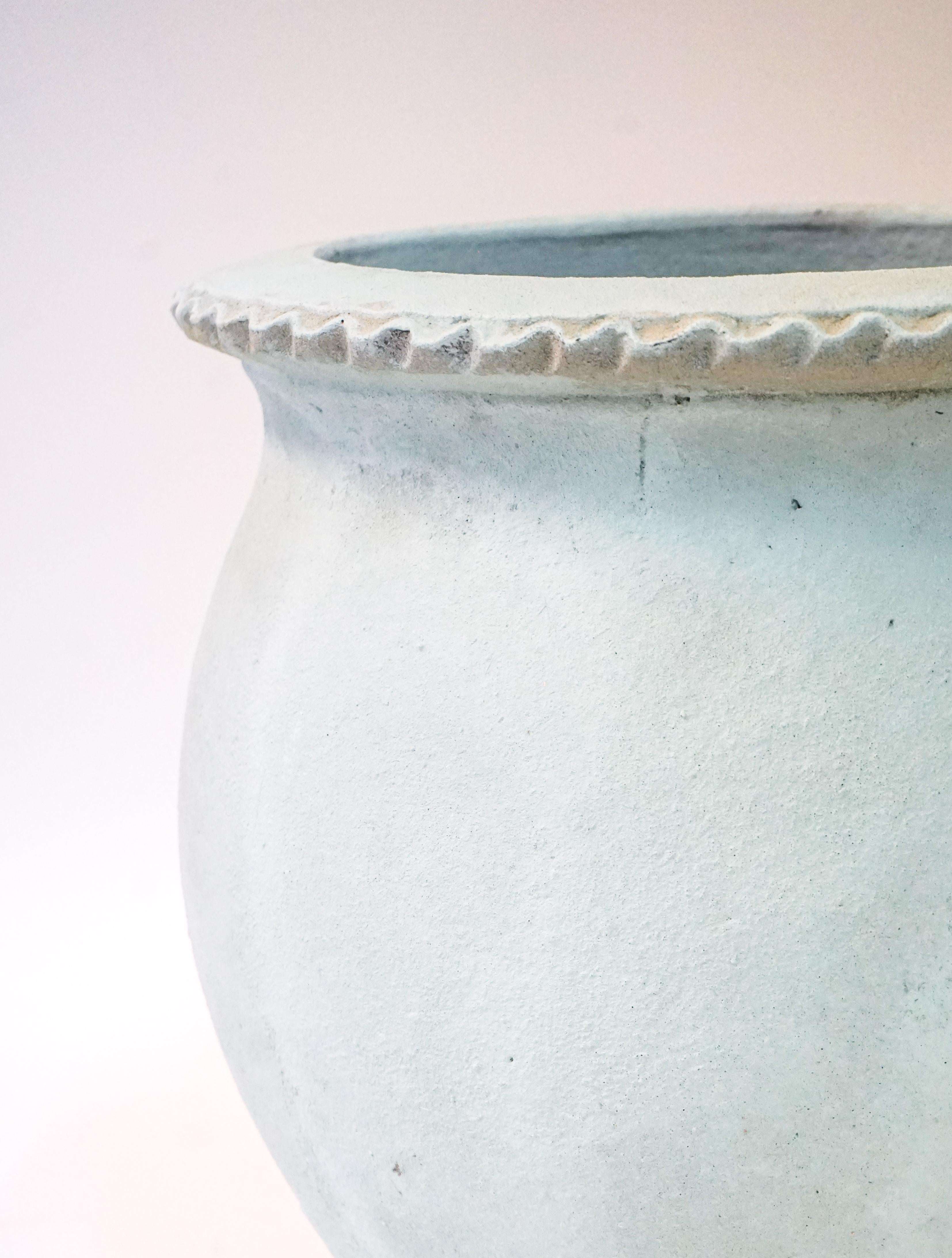 These French contemporary terracotta vessels were handmade in the Anduze valley. The light blue finish gives the planter a modern character.

Measurements: 17