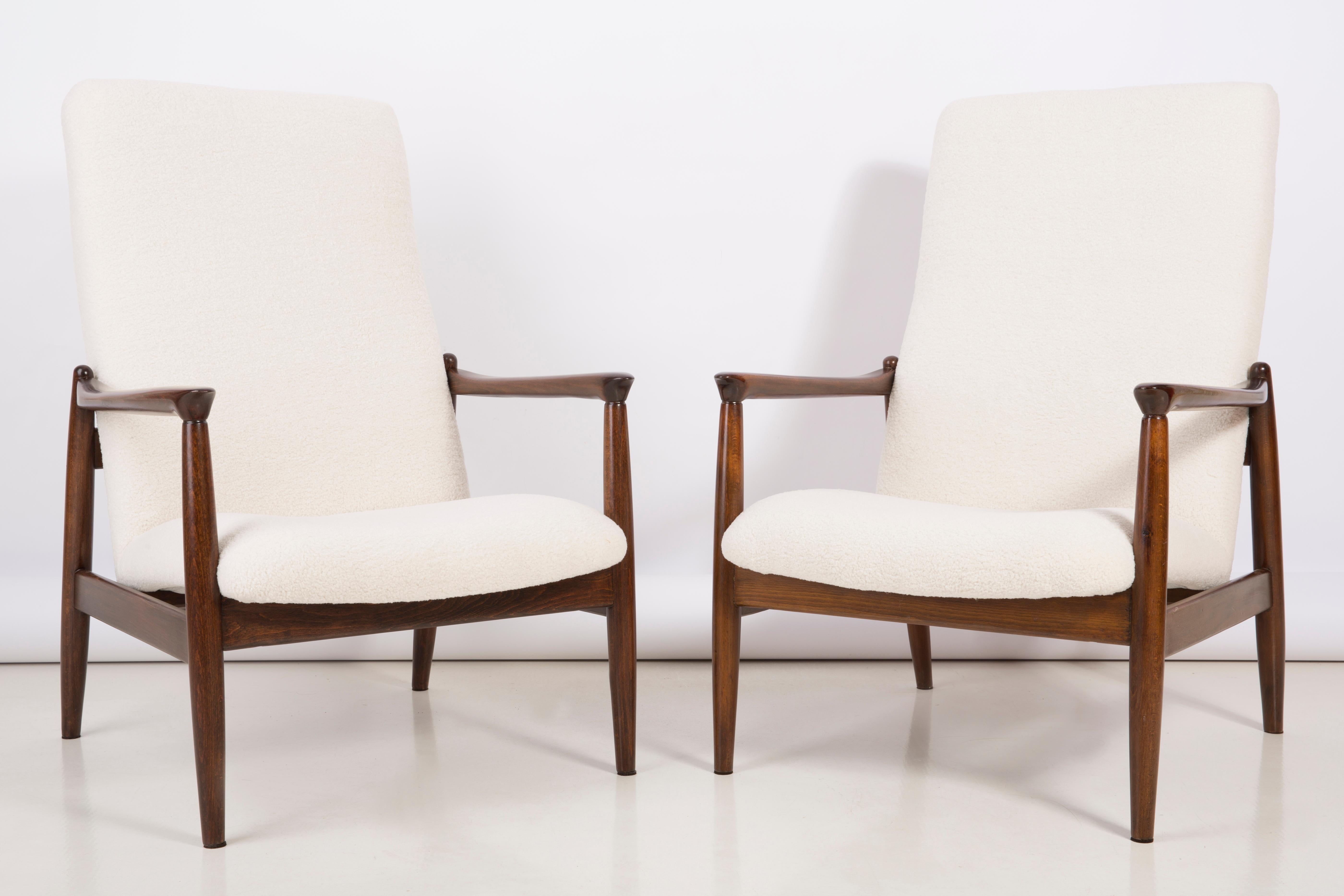 A pair of Light crème bouclé armchairs, designed by Edmund Homa, a Polish architect, designer of Industrial Design and interior architecture, professor at the Academy of Fine Arts in Gdansk.

The armchairs were made in the 1960s in the