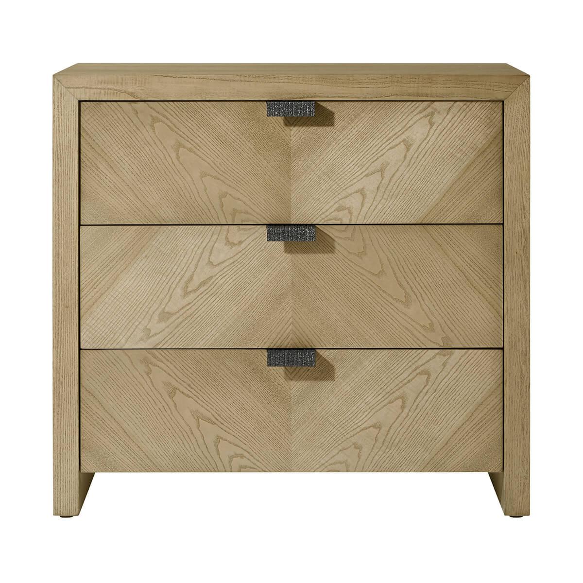 three drawer nightstand made of figured cathedral ash in artful grain patterns of our light dune finish with textured metal pulls in our Ember finish and soft close drawers.

Dimensions: 32